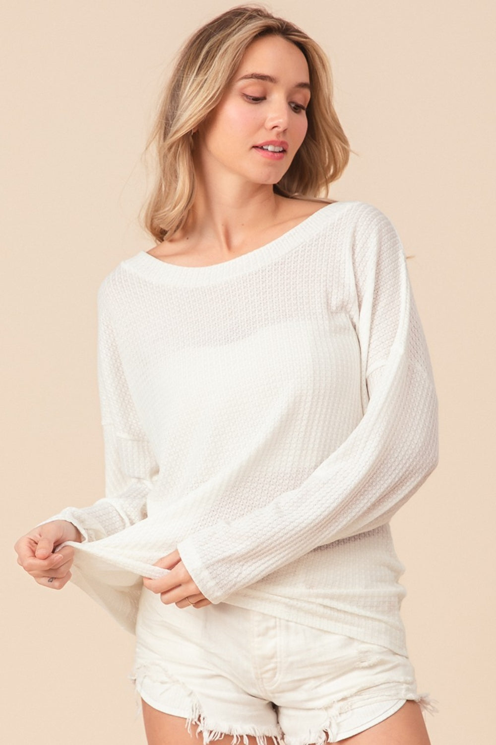 The Waffled Backless Drawstring Top is a flirty and stylish choice for your summer wardrobe. Featuring a waffled texture, this top adds depth and interest to your look. The backless design with a drawstring detail creates a playful and alluring silhouette.