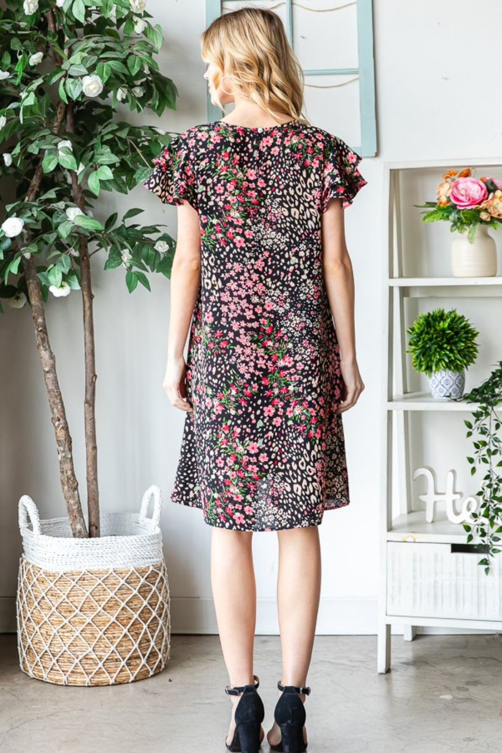 Get ready to turn heads in this stunning Printed Ruffled Short Sleeve Dress. With its eye-catching print and playful ruffled sleeves, this dress exudes feminine charm. The best part? It comes with pockets, adding a practical touch to this stylish piece. S - 3X