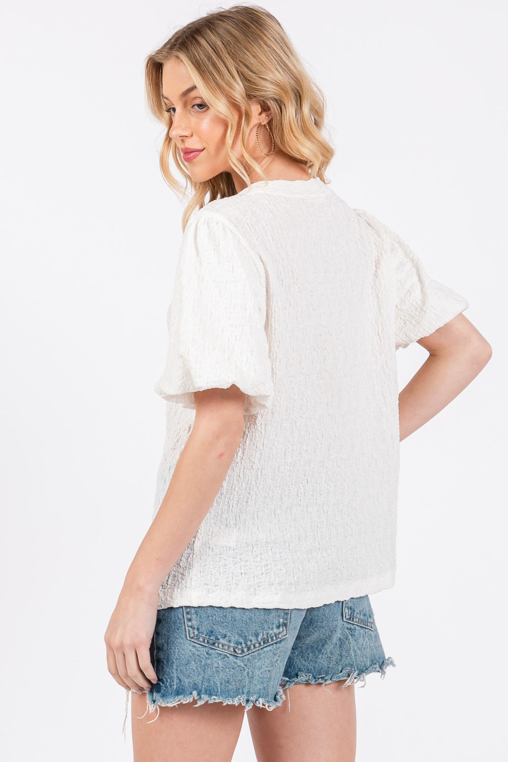 The Textured Puff Sleeve Top is a trendy and feminine top that adds a touch of drama to any outfit. The textured fabric creates visual interest and dimension, making it a standout piece in your wardrobe. The puff sleeves add a playful and romantic vibe to the top, perfect for both casual and dressy occasions. S-L