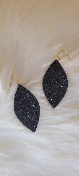 Black Sequin Marquise Earrings Marquise shape Black glitter and sequins Brushed gold fish hook dangle earrings Rubber earring back Length 3” Whether you want to be on the wild side or classy this earring set it will add a fun touch to your outfit