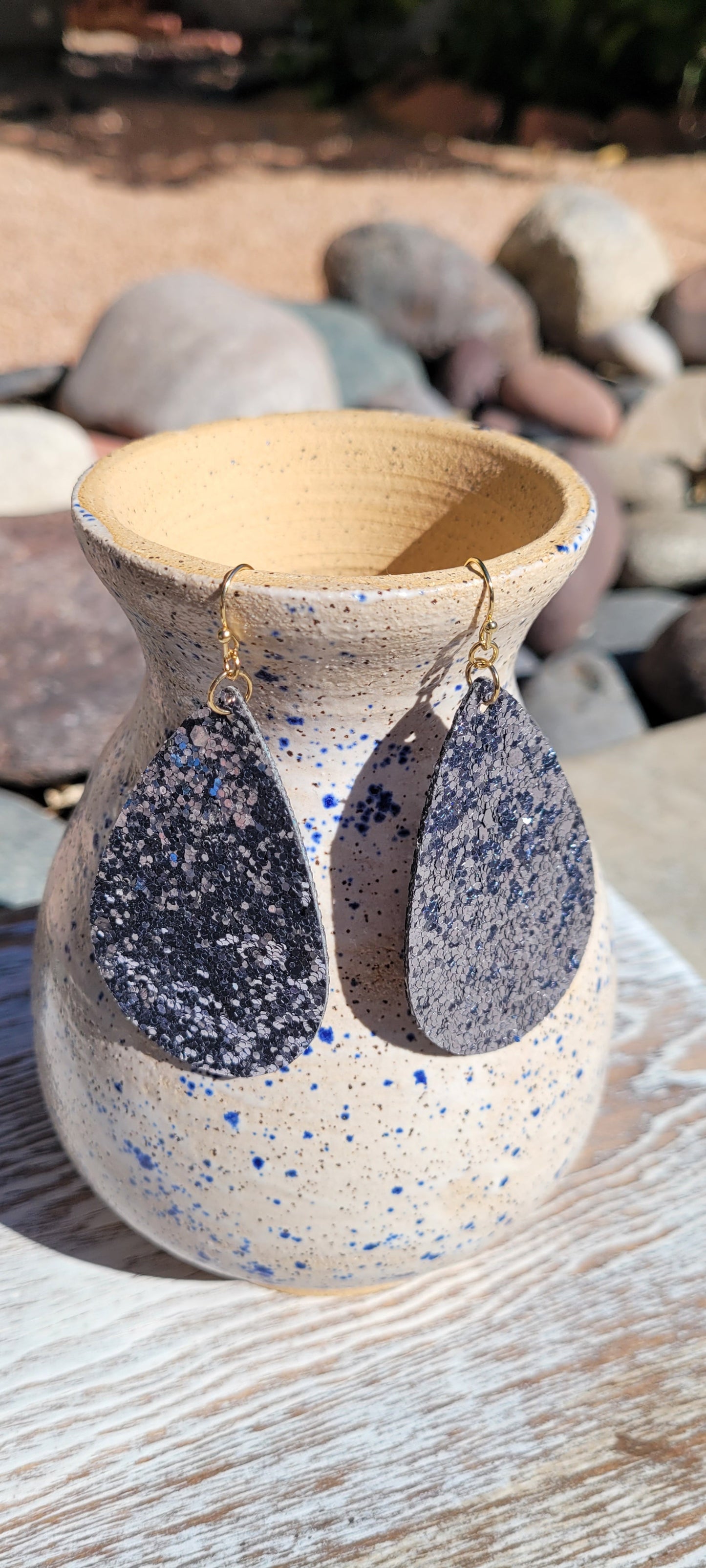 Teardrop shape Pewter glitter and sequins Brushed gold fish hook dangle earrings Rubber earring back Length 3” Whether you want to be on the wild side or classy this earring set it will add a fun touch to your outfit