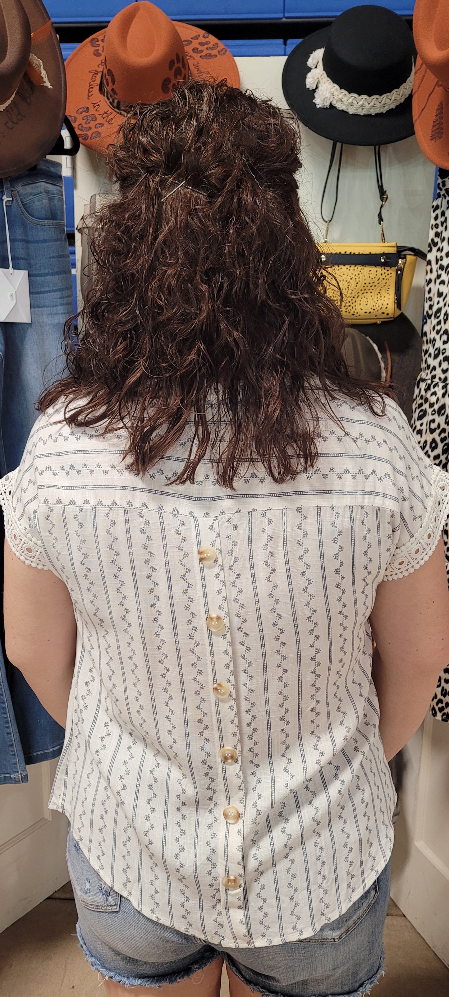 Feel flirty and fun in our Zig Zag Top! This cute top has an eye catching lace trim round neckline, extended shoulders, and dolman sleeves with lace trim. Plus, the front lace inset detail and back non-functional buttons will keep heads turning! Who says fashion can't be playful? Sashay into the room in this statement piece! Sizes small through large.