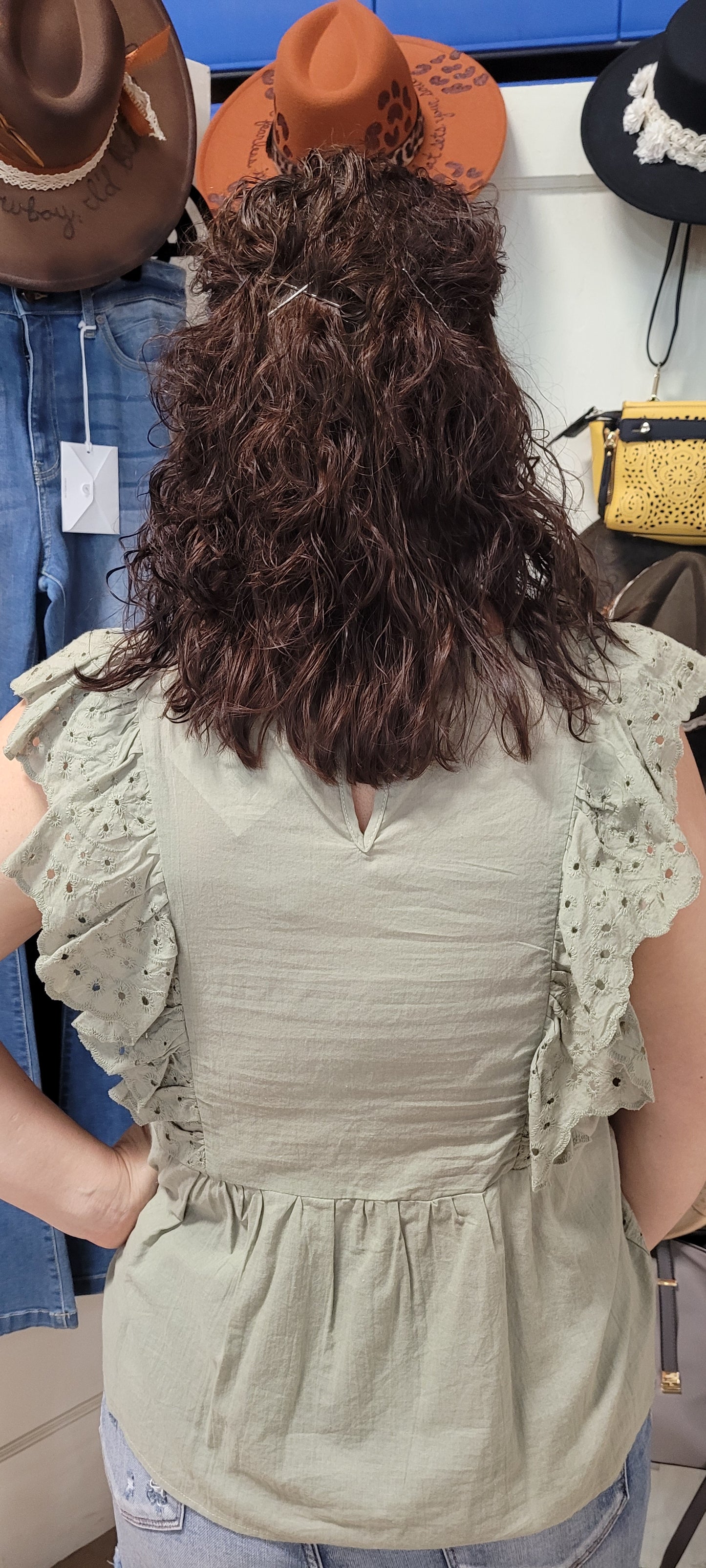 Shhh! Don’t tell anyone, but I like you! “Secret Crush” features ruffled lace trim short sleeves with eyelet design, scalloped hemline, keyhole back with button enclosure, and rounded neckline. This top is great for vacation, those hot summer days, or a shopping day with your friends. Sizes small through large.