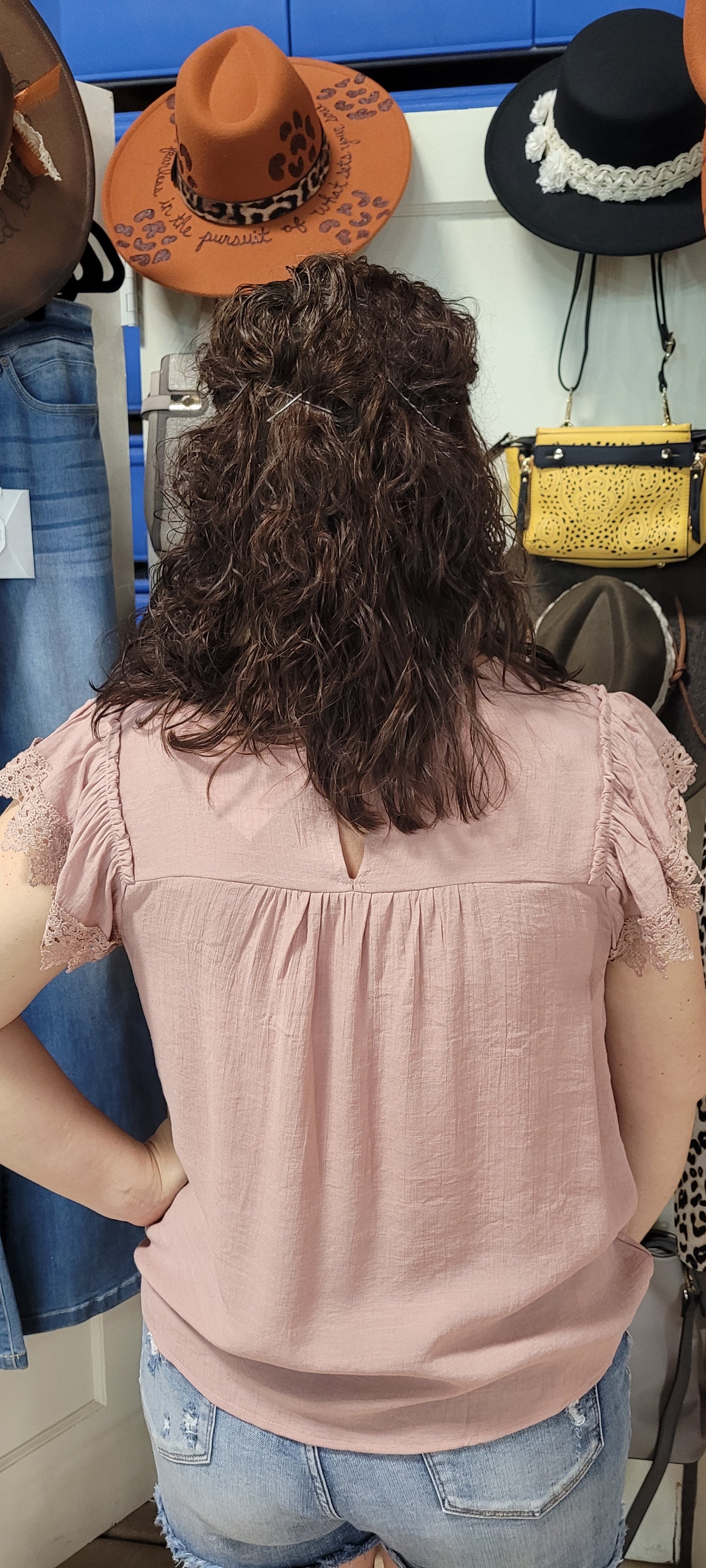 This top lets you express your fun side while looking your best. Put together pretty lace, a back keyhole button detail and a comfy round neckline, and you have the perfect top for any style! (Yeah, you might just have to stop and smell the roses, or in this case, the Dusty Rose Top!) Sizes small through large.