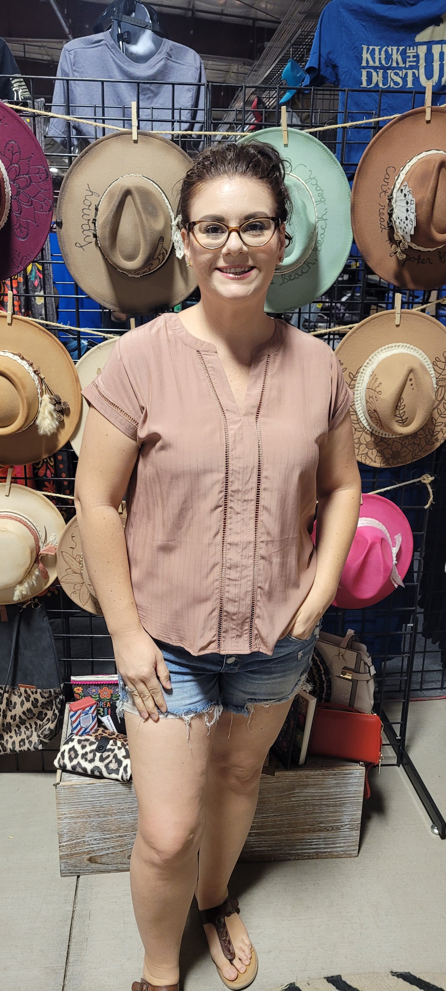 This top is a must-have for any fashionista! It's the perfect blend of chic and subtle boho style with its split neck, ladder lace trim, and short sleeves. Pop on this terracotta beauty and you'll be ready to turn heads at any occasion! #Yasss Sizes small through large.