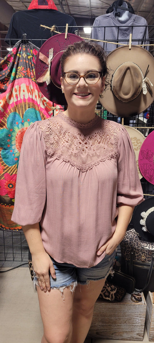 Rock your look with this ravishing top that'll take your fashion to the next level! With its elegant lace mock neck, stylish back-button closure with keyhole, and oh-so-pretty front lace inset and pleated bubble sleeves, you'll be sure to draw admiring glances wherever you go. Let's get fabulous! Sizes small through large.