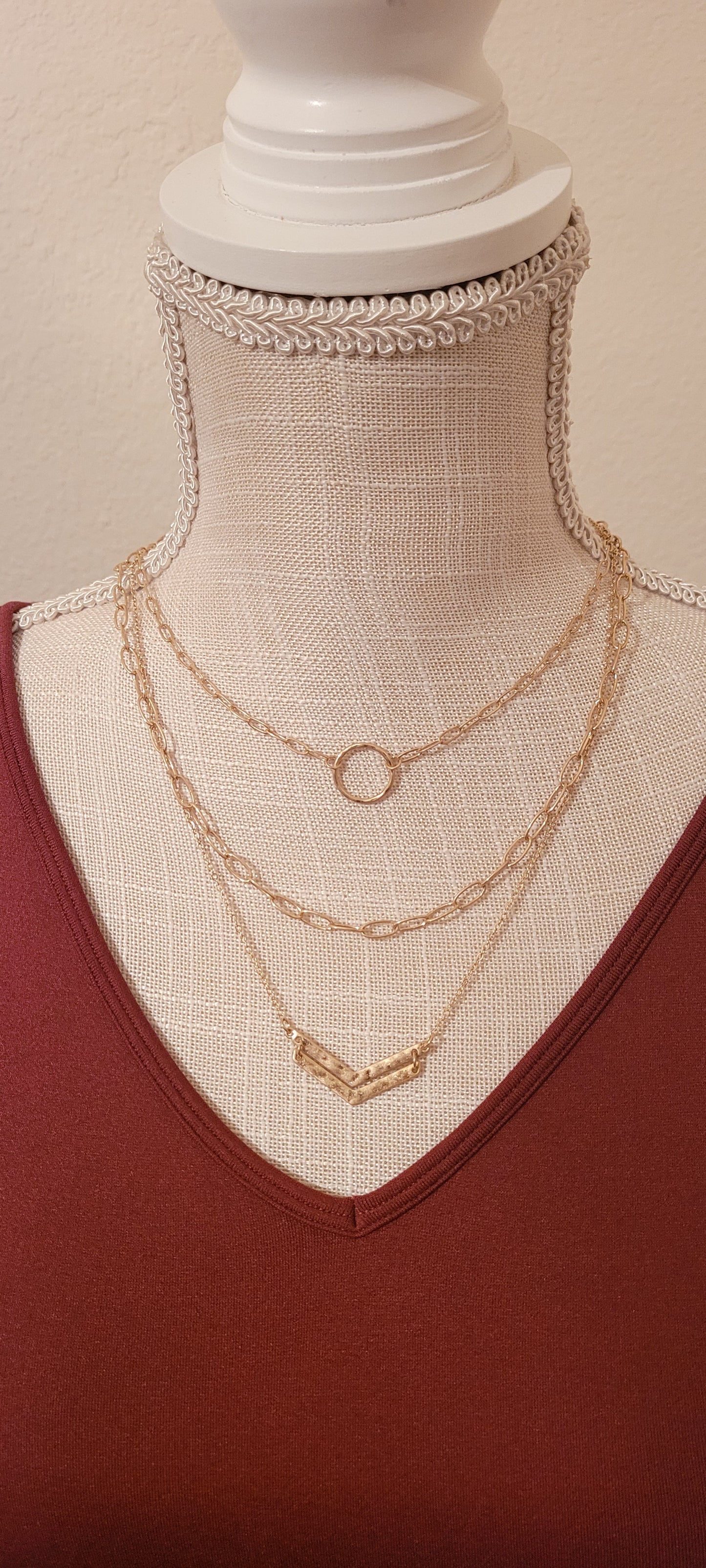Approximate Length: Adjustable chain 16+2 inches Set of 3 adjustable necklaces Color: Gold link chains with chevron pendant Limited supply!