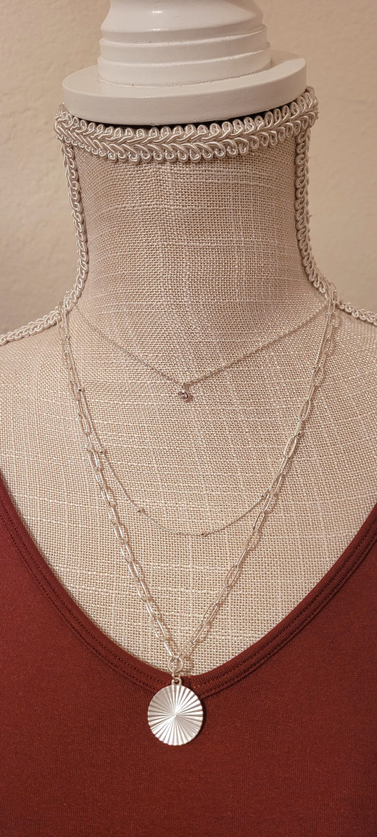 Approximate Length: Adjustable chain 16+2 inches Color: Silver link chains with circle pendant, silver beads, and small clear crystal Limited supply!