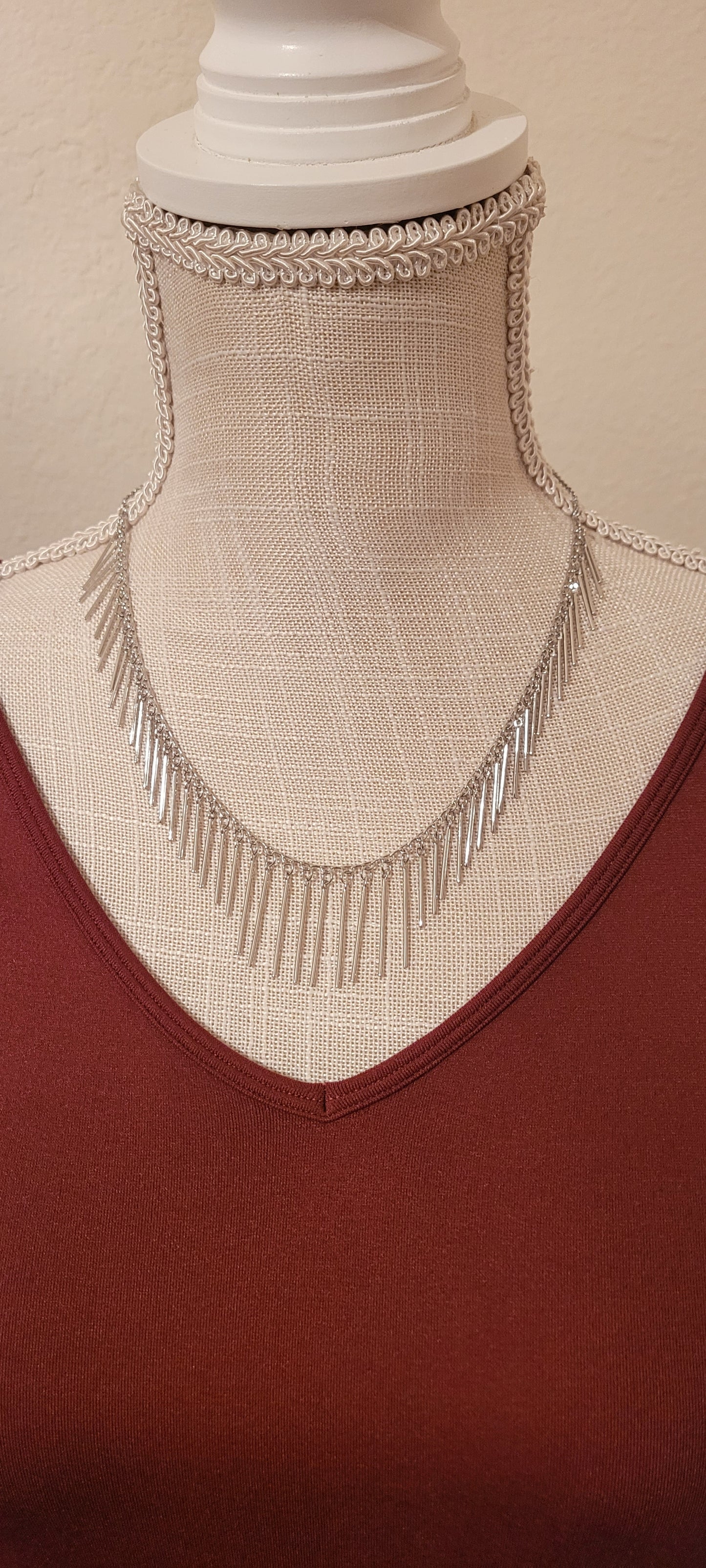 Approximate Length: Adjustable chain 16+2 inches Color: Silver link chain with silver fringe Limited supply!
