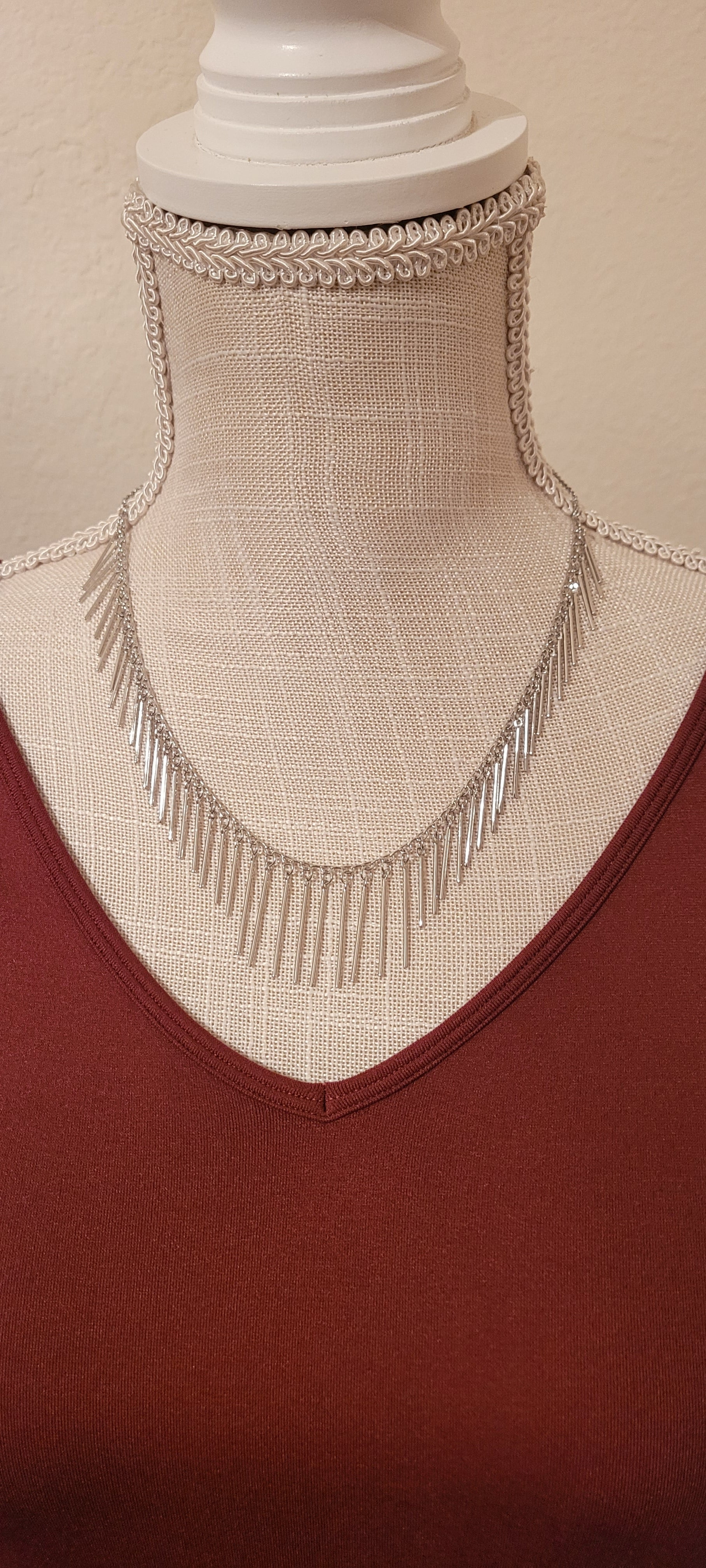 Approximate Length: Adjustable chain 16+2 inches Color: Silver link chain with silver fringe Limited supply!