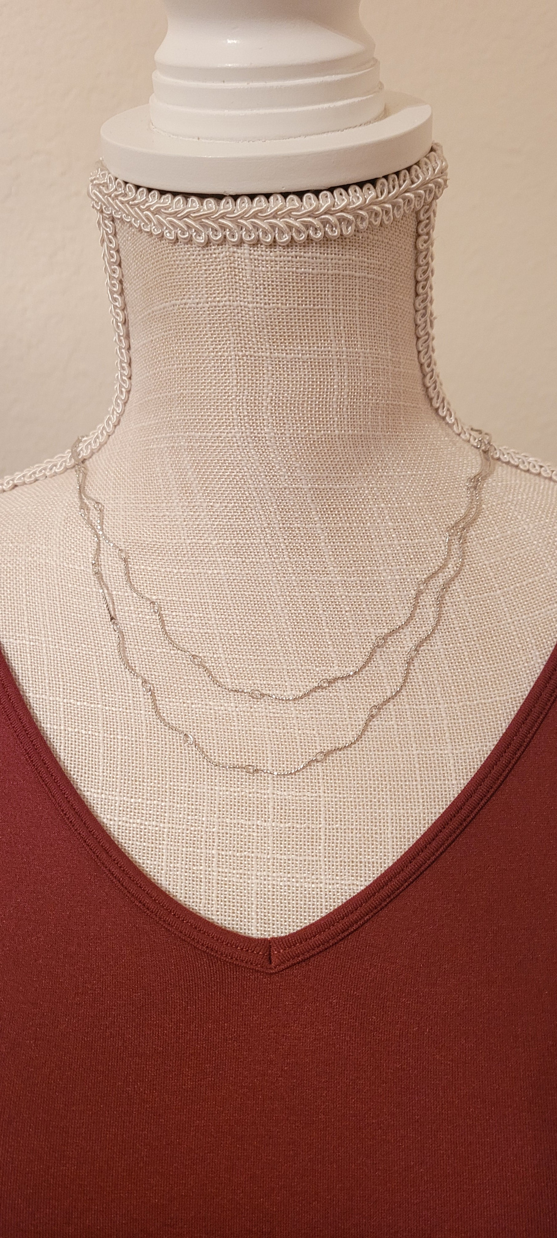 Approximate Length: Adjustable chain 16+2 inches Color: Silver wavy link chain Limited supply!