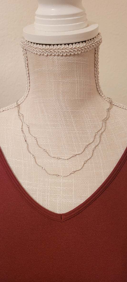 Approximate Length: Adjustable chain 16+2 inches Color: Silver wavy link chain Limited supply!