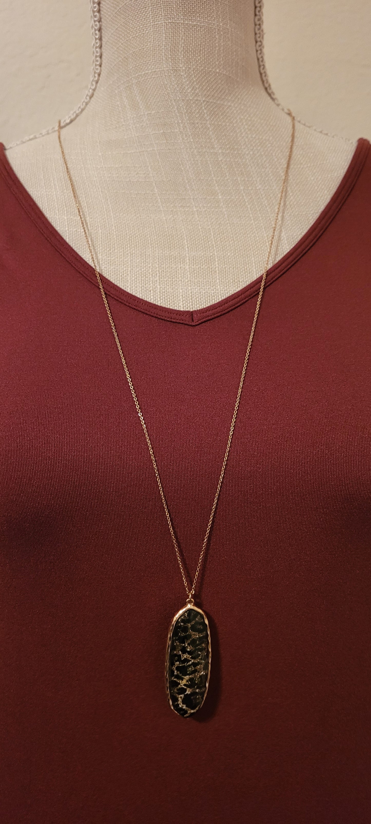 Sparkling gold color necklace with black and brown leopard print pendant.
Whether you want to be on the wild side or classy this necklace will add a fun touch to your outfit.
Length of chain is adjustable to 28 inches.