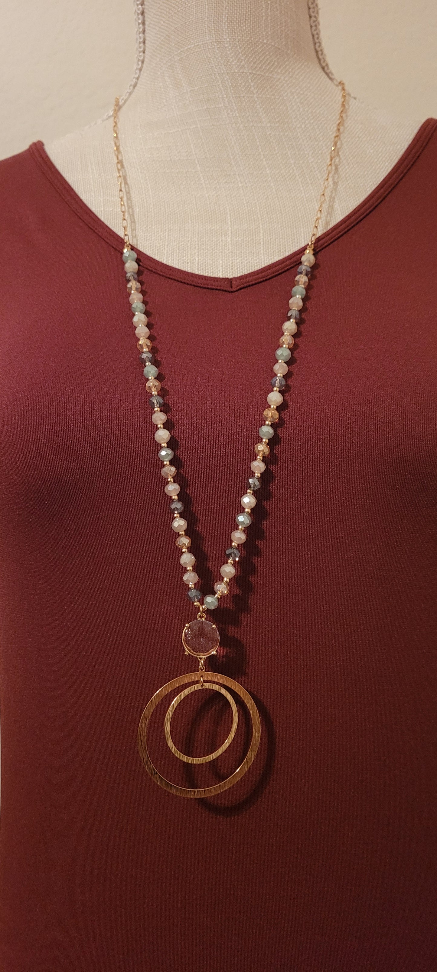 Approximate Length: Adjustable 32+2 inches Color: Gold link chain with various blue-gray glass beads, clear crystal and floating circle pendants Limited supply!