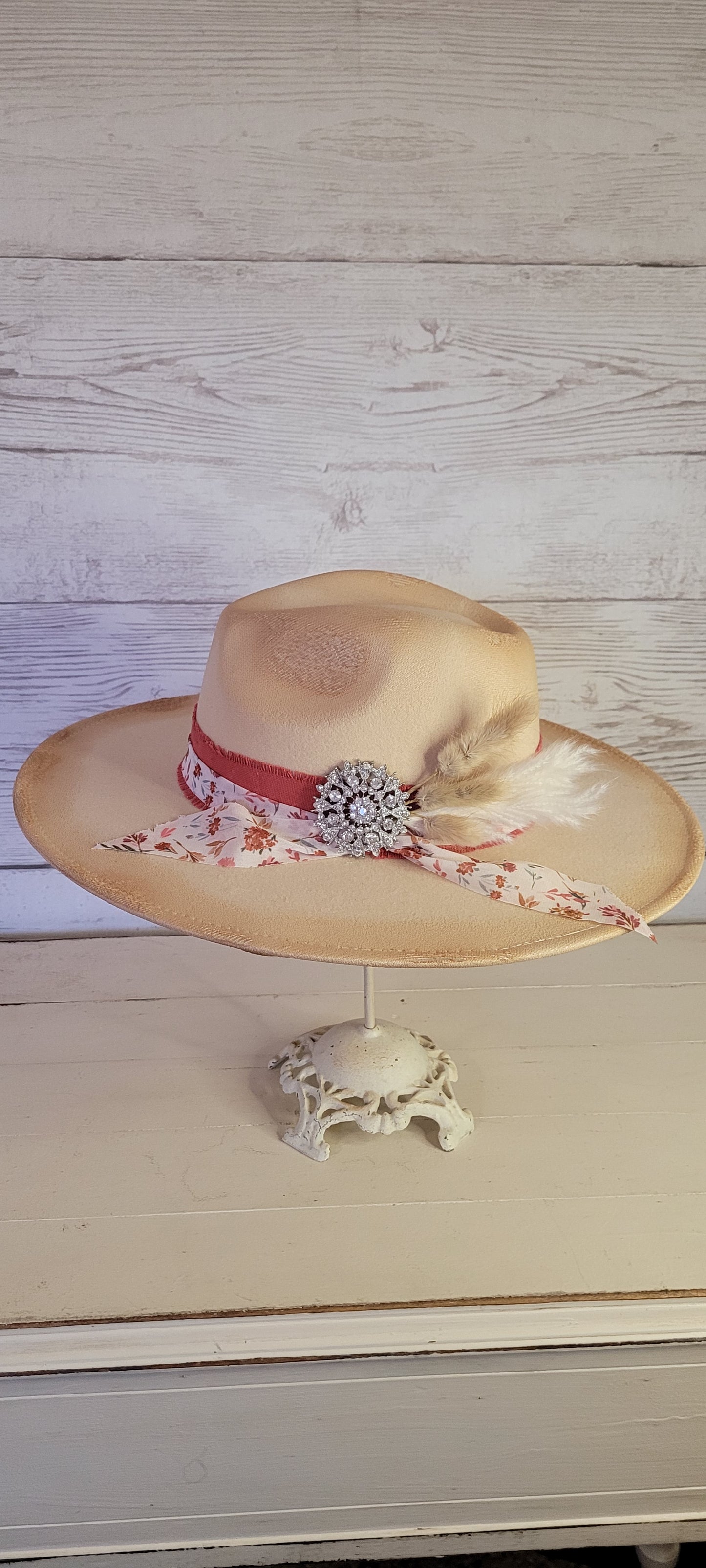 Lace ribbon, sheer floral ribbon, cattails, pampas & rhinestone brooch Felt hat Flat brim 65% polyester and 35% cotton Ribbon drawstring for hat size adjustment Head Circumference: 24" Crown Height: 5" Brim Length: 15.75" Brim Width: 14.5" Branded & numbered inside crown Custom designed by Kayla