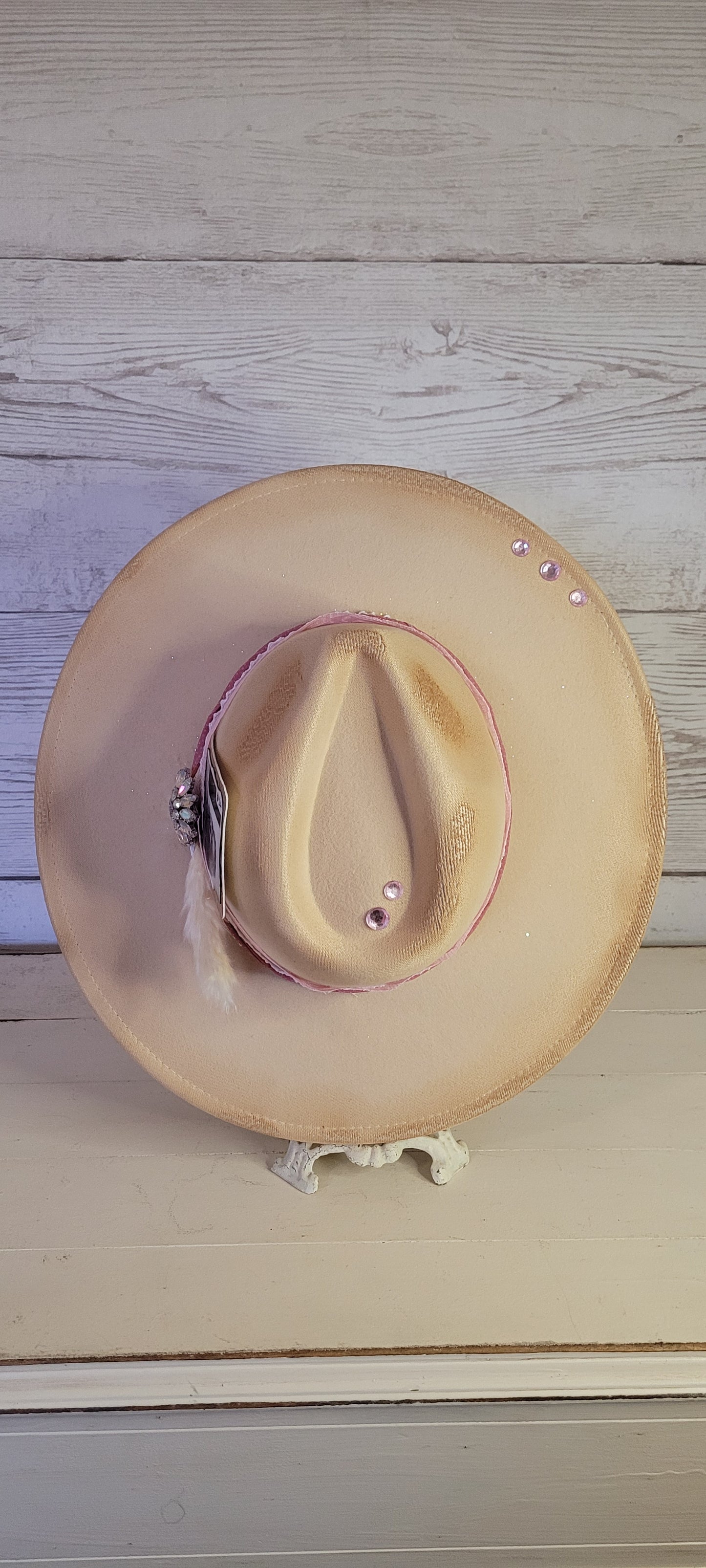 Pink ribbon & lace, natural lace ribbon, pampas, AB rhinestone brooch, light pink rhinestones & playing card Felt hat Flat brim 65% polyester and 35% cotton Ribbon drawstring for hat size adjustment Head Circumference: 24" Crown Height: 5" Brim Length: 15.75" Brim Width: 14.5" Branded & numbered inside crown Custom burned & designed by Kayla
