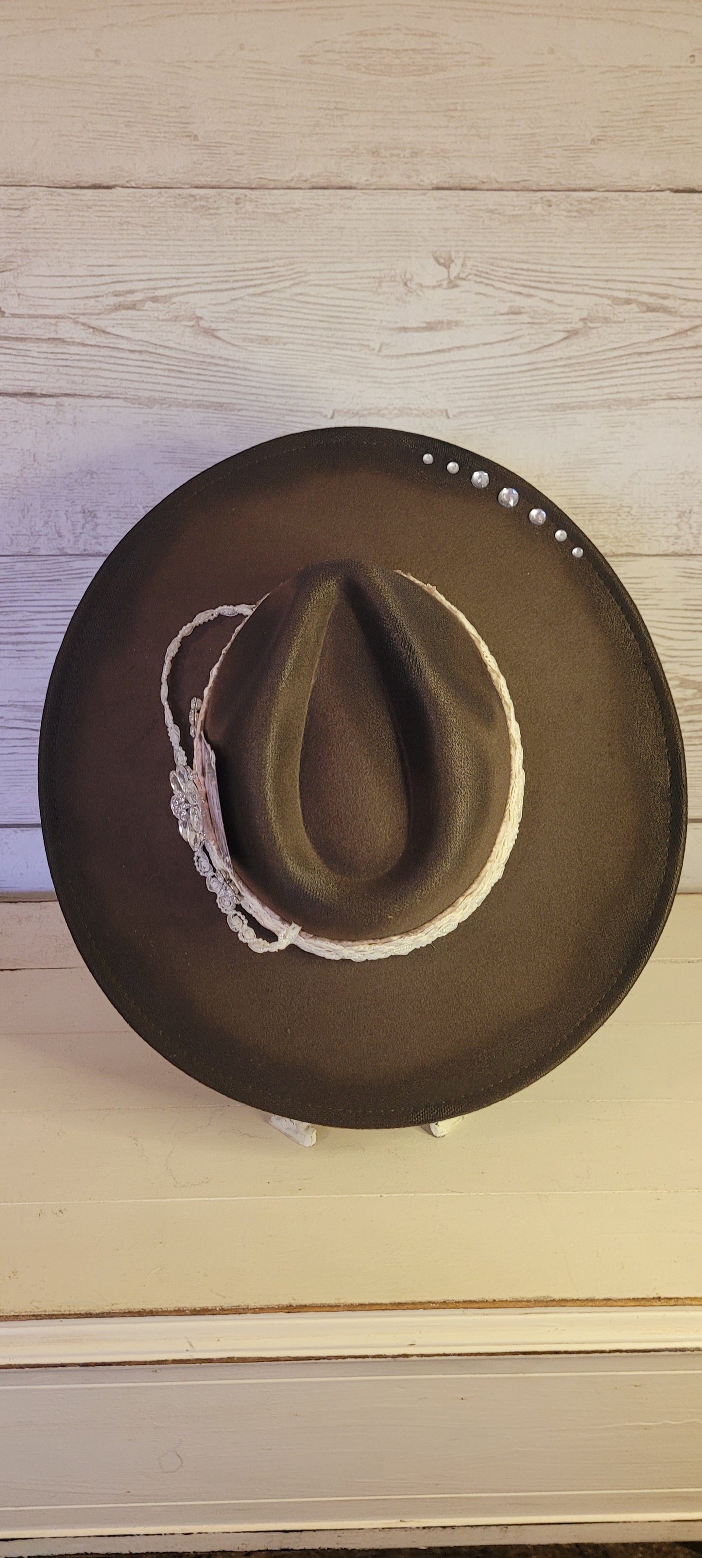 Features rhinestone details on brim, crystal brooches, & playing card, light rose ribbon, natural lace ribbon, pearl ribbon Felt hat Flat brim 65% polyester and 35% cotton Ribbon drawstring for hat size adjustment Head Circumference: 24" Crown Height: 5" Brim Length: 15.75" Brim Width: 14.5" Branded & numbered inside crown Custom designed by Kayla