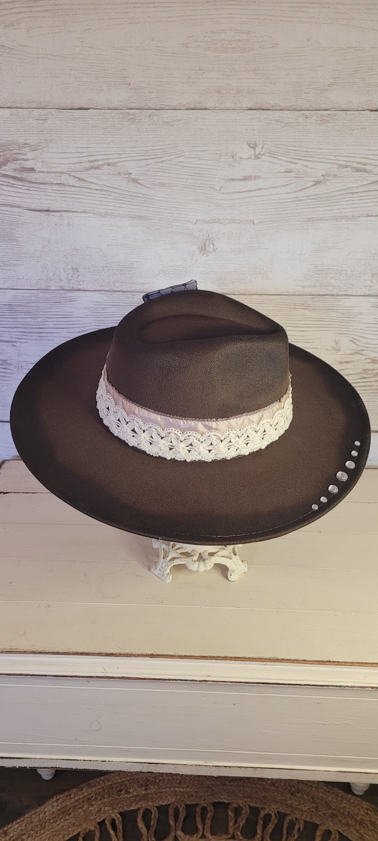 Features rhinestone details on brim, crystal brooches, & playing card, light rose ribbon, natural lace ribbon, pearl ribbon Felt hat Flat brim 65% polyester and 35% cotton Ribbon drawstring for hat size adjustment Head Circumference: 24" Crown Height: 5" Brim Length: 15.75" Brim Width: 14.5" Branded & numbered inside crown Custom designed by Kayla