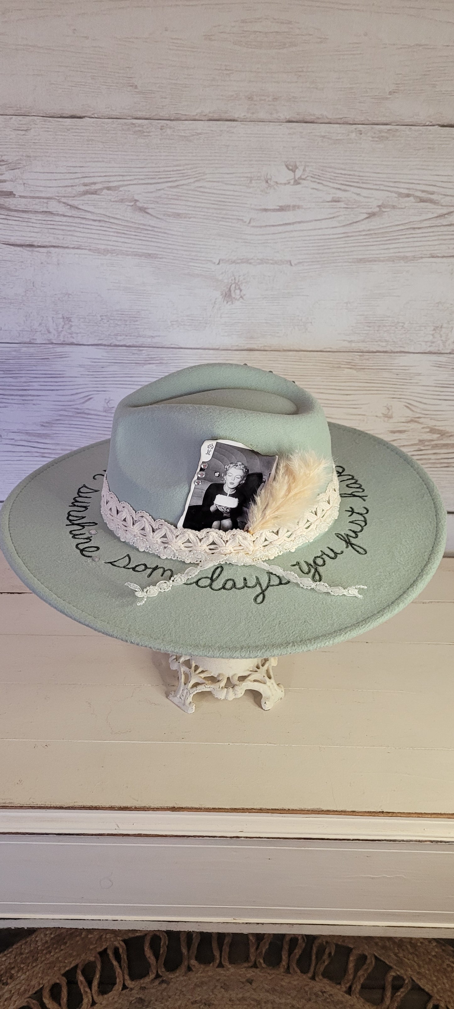 Features sunshine & "somedays you just have to create your own sunshine" engraved Natural lace ribbon, pearl lace ribbon, pampas, playing card with rhinestones Felt hat Flat brim 65% polyester and 35% cotton Ribbon drawstring for hat size adjustment Head Circumference: 24" Crown Height: 5" Brim Length: 15.75" Brim Width: 14.5" Branded & numbered inside crown Custom burned & engraved by Kayla
