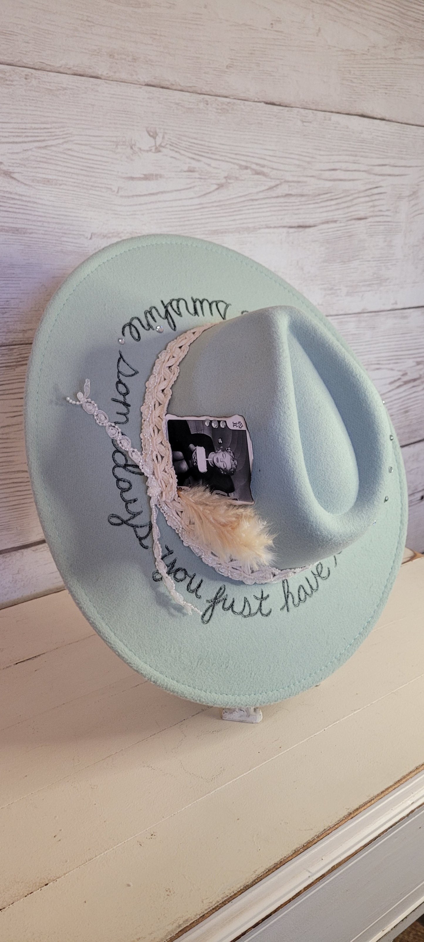 Features sunshine & "somedays you just have to create your own sunshine" engraved Natural lace ribbon, pearl lace ribbon, pampas, playing card with rhinestones Felt hat Flat brim 65% polyester and 35% cotton Ribbon drawstring for hat size adjustment Head Circumference: 24" Crown Height: 5" Brim Length: 15.75" Brim Width: 14.5" Branded & numbered inside crown Custom burned & engraved by Kayla