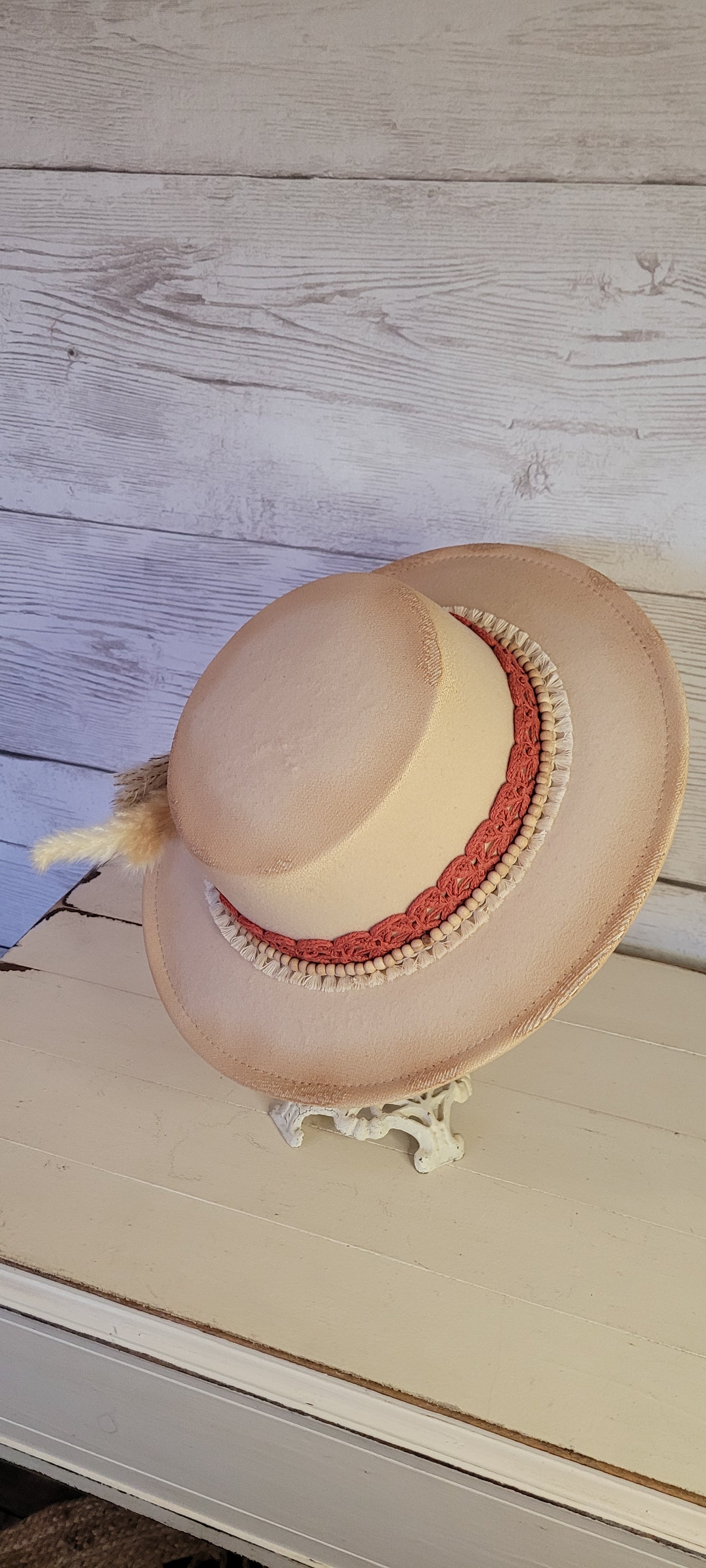 Lace ribbon, tassel ribbon, wooden bead band, button, & pampas Felt hat Flat brim 100% polyester Ribbon drawstring for hat size adjustment Head Circumference: 24" Crown Height: 3.5" Brim Length: 13.5" Brim Width: 12.75" Branded & numbered inside crown Custom burned by Kayla