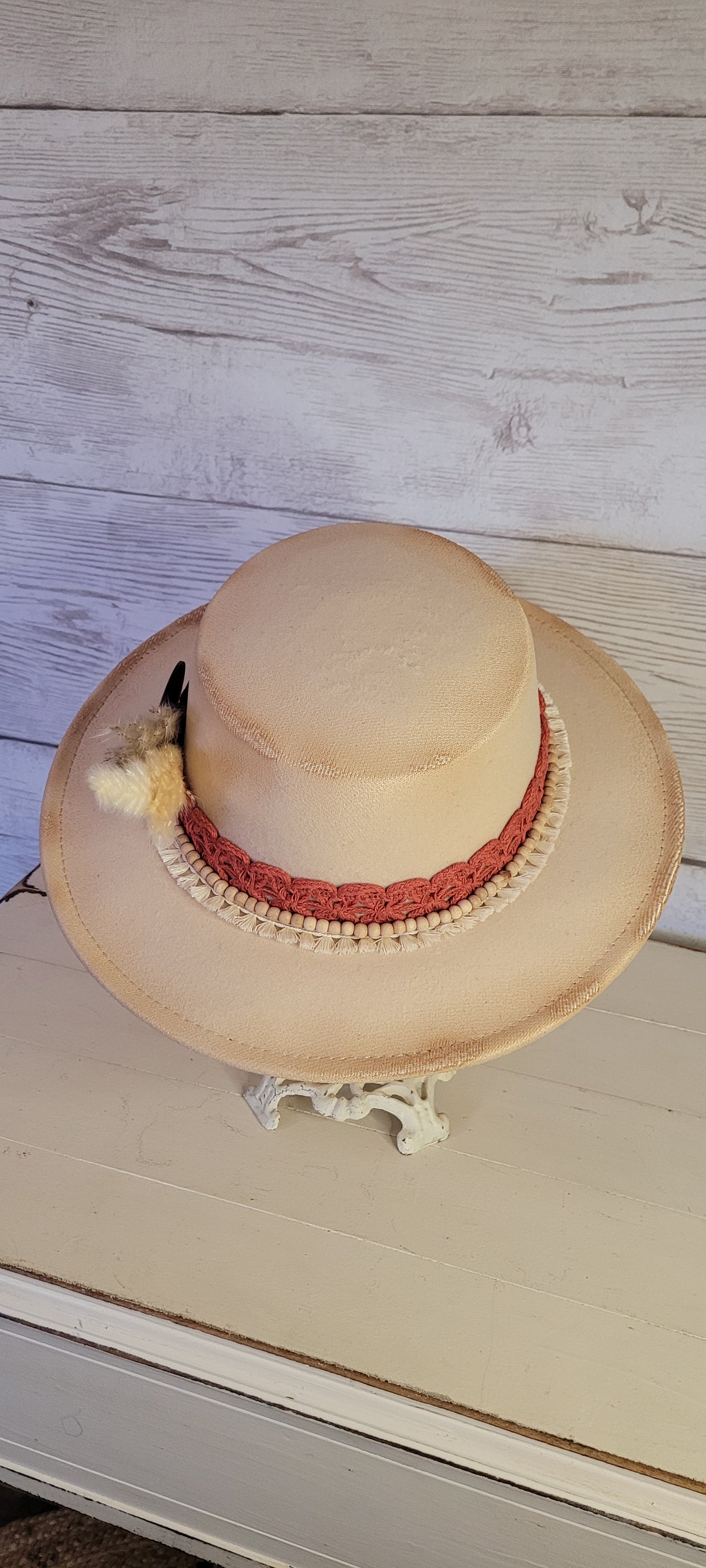Lace ribbon, tassel ribbon, wooden bead band, button, & pampas Felt hat Flat brim 100% polyester Ribbon drawstring for hat size adjustment Head Circumference: 24" Crown Height: 3.5" Brim Length: 13.5" Brim Width: 12.75" Branded & numbered inside crown Custom burned by Kayla
