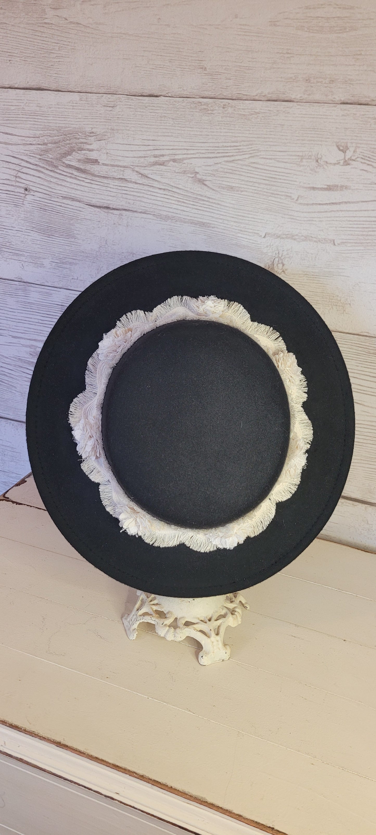 Tassel wavy ribbon & flowers Felt hat Flat brim 100% polyester Ribbon drawstring for hat size adjustment Head Circumference: 24" Crown Height: 3.5" Brim Length: 13.5" Brim Width: 12.75" Branded & numbered inside crown Custom designed by Kayla