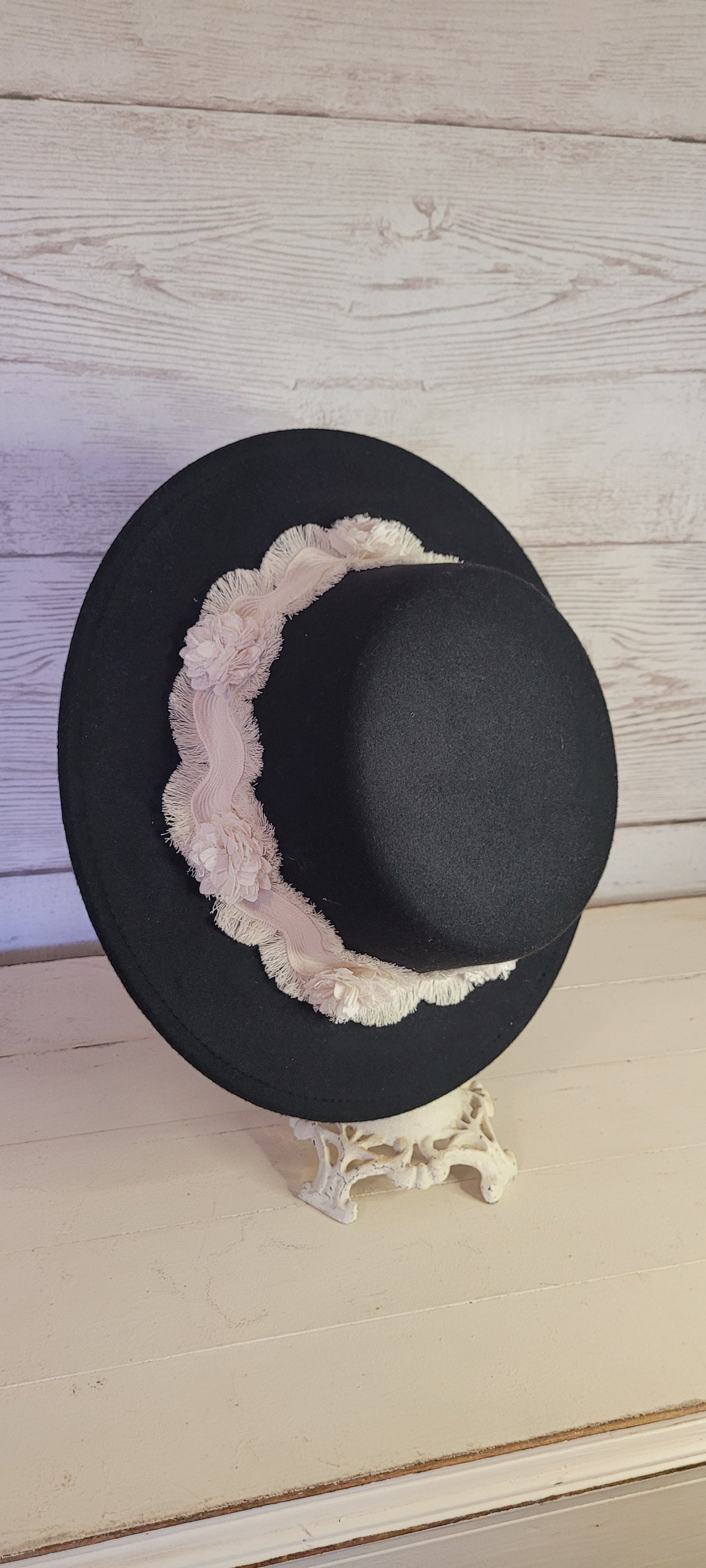 Tassel wavy ribbon & flowers Felt hat Flat brim 100% polyester Ribbon drawstring for hat size adjustment Head Circumference: 24" Crown Height: 3.5" Brim Length: 13.5" Brim Width: 12.75" Branded & numbered inside crown Custom designed by Kayla