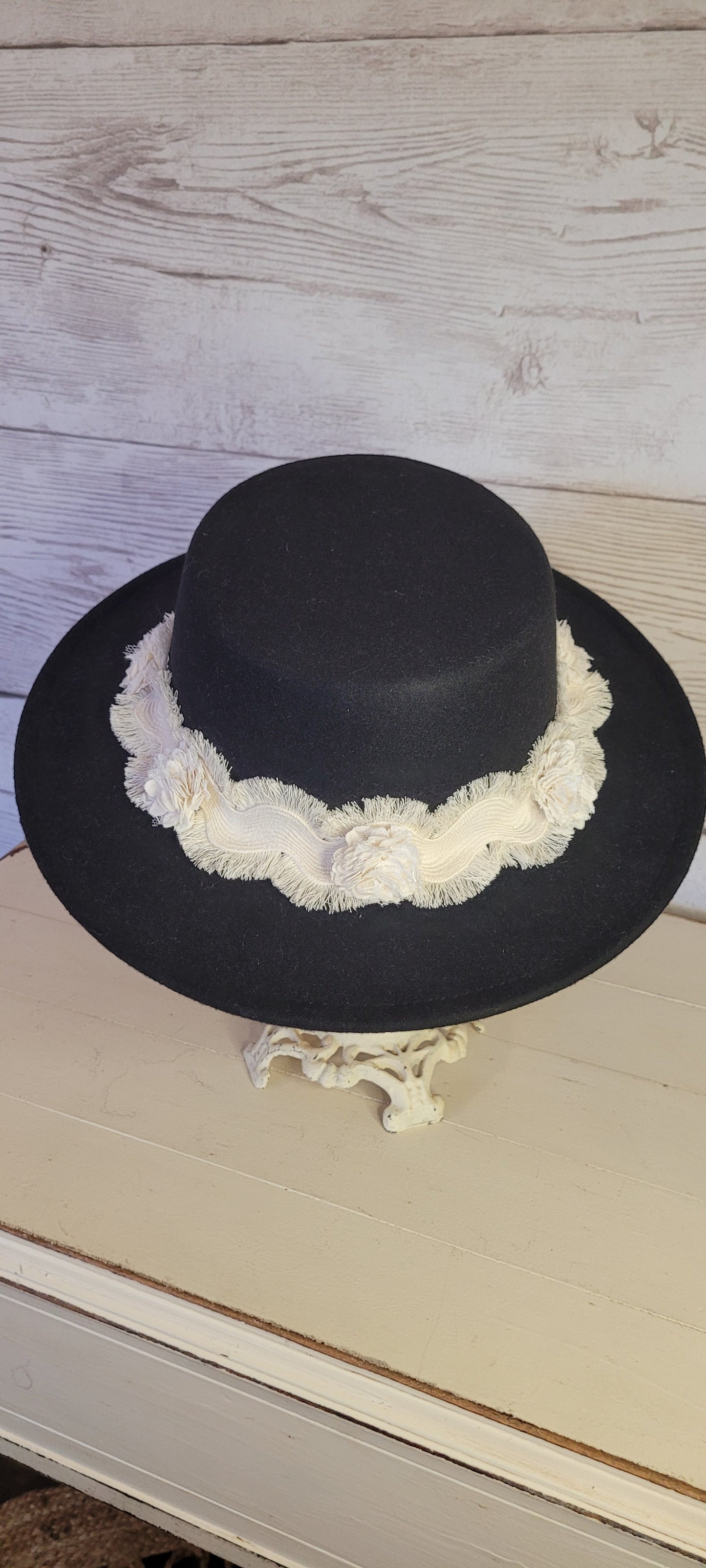 Tassel wavy ribbon & flowers Felt hat Flat brim 100% polyester Ribbon drawstring for hat size adjustment Head Circumference: 24" Crown Height: 3.5" Brim Length: 13.5" Brim Width: 12.75" Branded & numbered inside crown Custom designed by Kayla