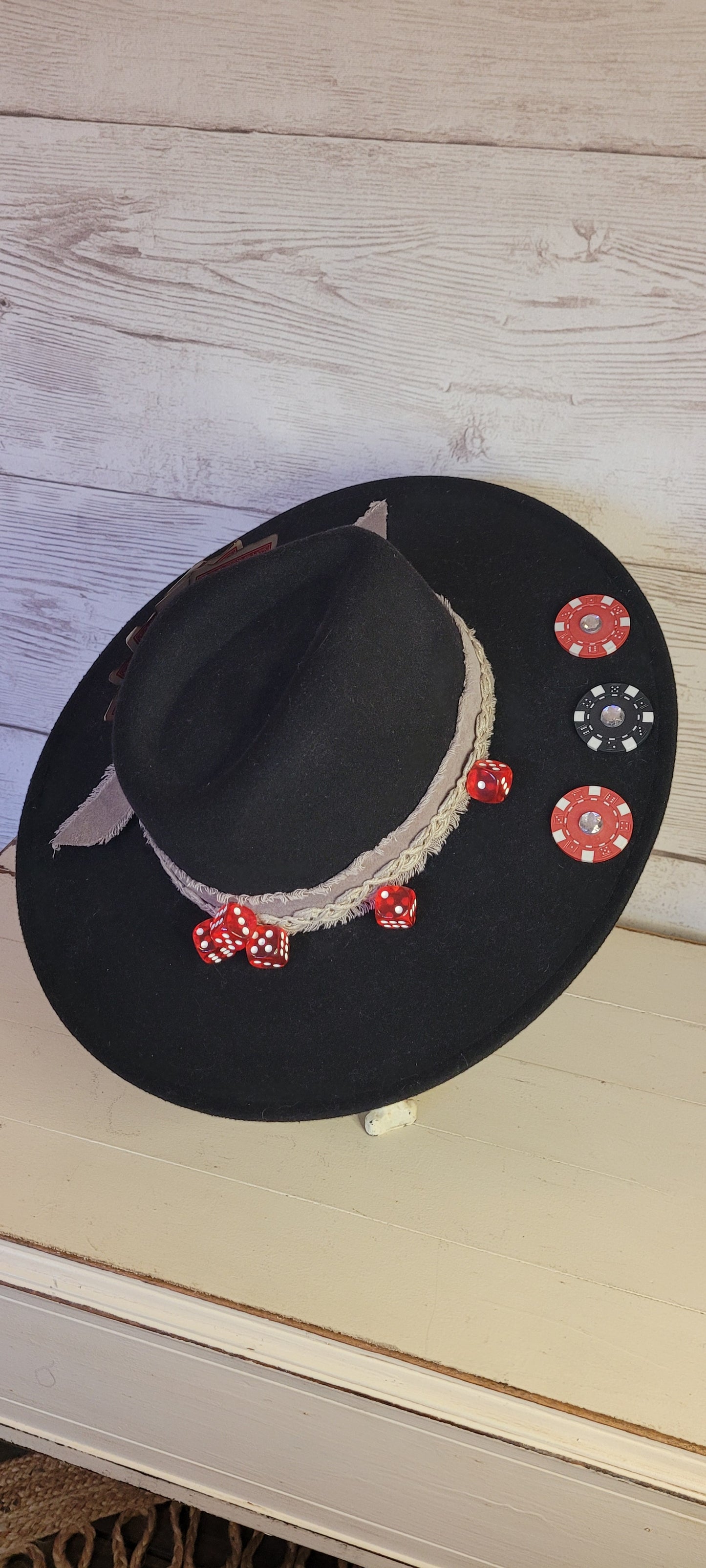 Features poker chips, dice, rhinestones, playing cards, natural frayed & lace ribbon, & metal horseshoe Felt hat Flat brim 35% cotton and 65% polyester Ribbon drawstring for hat size adjustment Head Circumference: 24" Crown Height: 5" Brim Length: 15.75" Brim Width: 14.5" Branded & numbered inside crown Custom designed by Kayla
