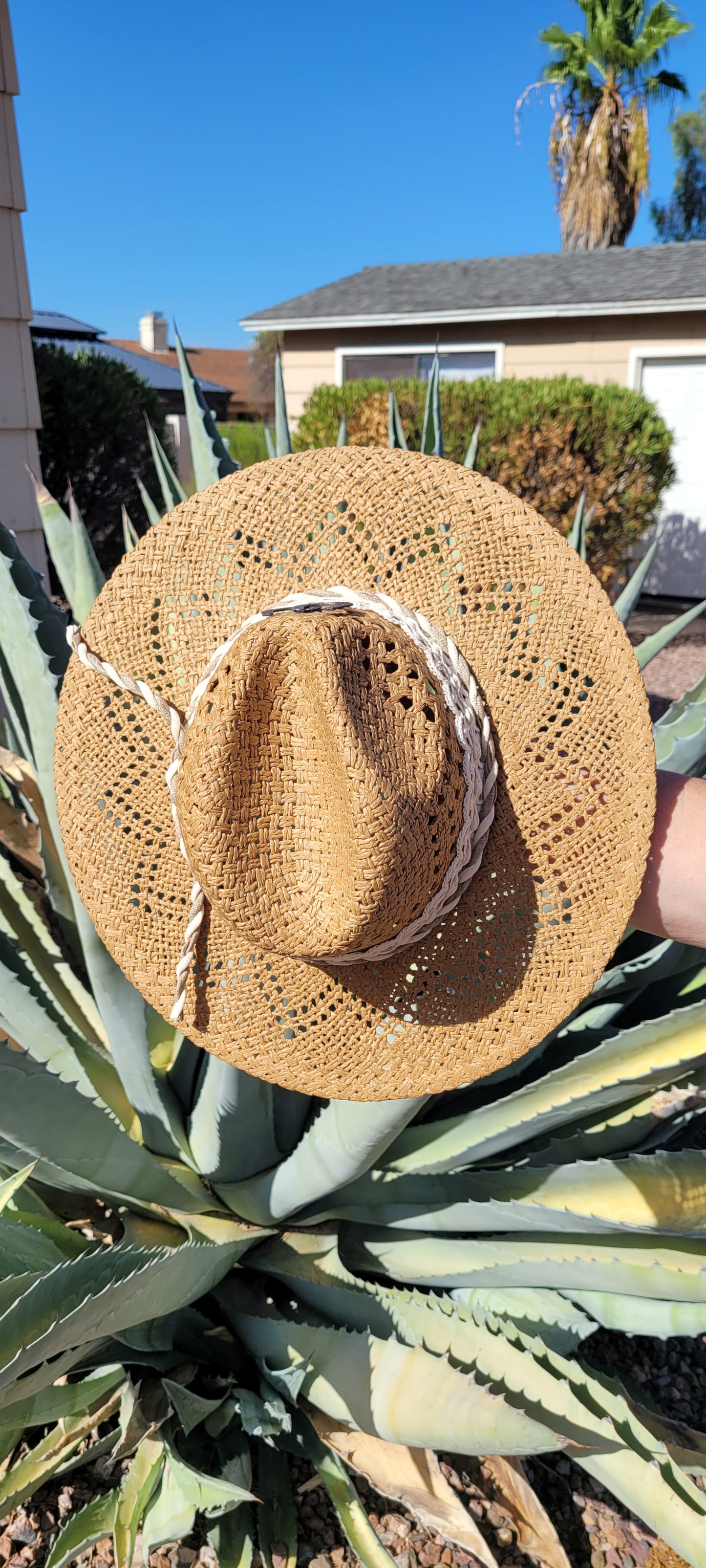 Lace ribbon, twisted gauze, metal horseshoes Straw hat Flat brim 65% polyester and 35% cotton Ribbon drawstring for hat size adjustment Head Circumference: 24" Crown Height: 5" Brim Length: 15.75" Brim Width: 14.75" Branded & numbered inside crown Custom designed by Kayla