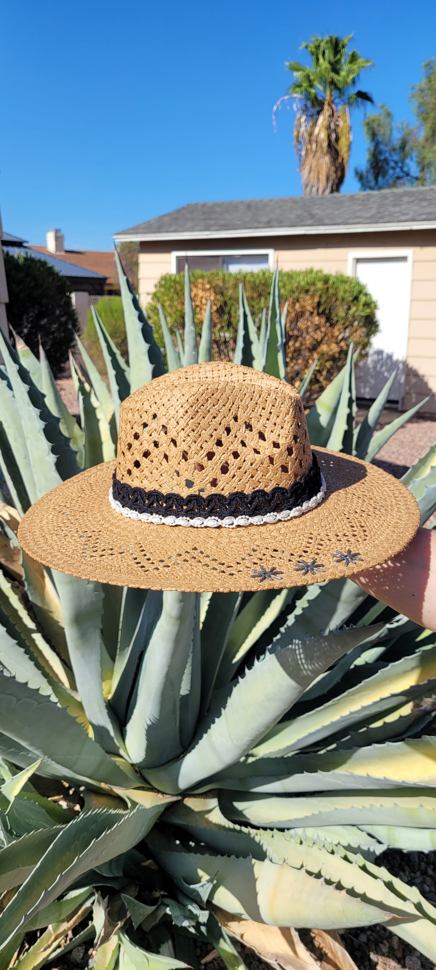 Lace ribbon, pearl ribbon, rowel (boot spur) pistol & decorative brooches Straw hat Flat brim 65% polyester and 35% cotton Ribbon drawstring for hat size adjustment Head Circumference: 24" Crown Height: 5" Brim Length: 15.75" Brim Width: 14.75" Branded & numbered inside crown Custom designed by Kayla