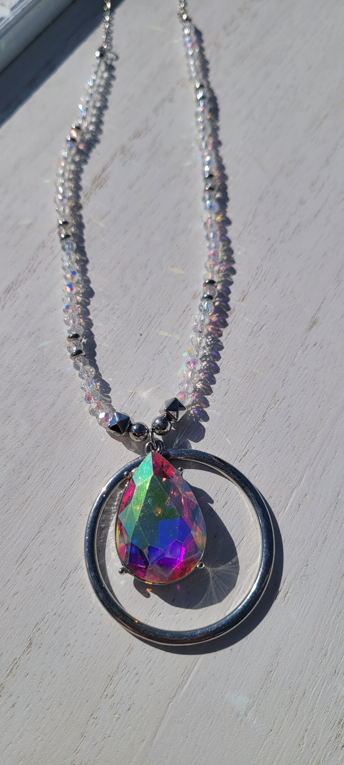 Pink Panache necklace Color: Clear bead and silver chain necklace with silver circle and AB teardrop pendant Limited supply!