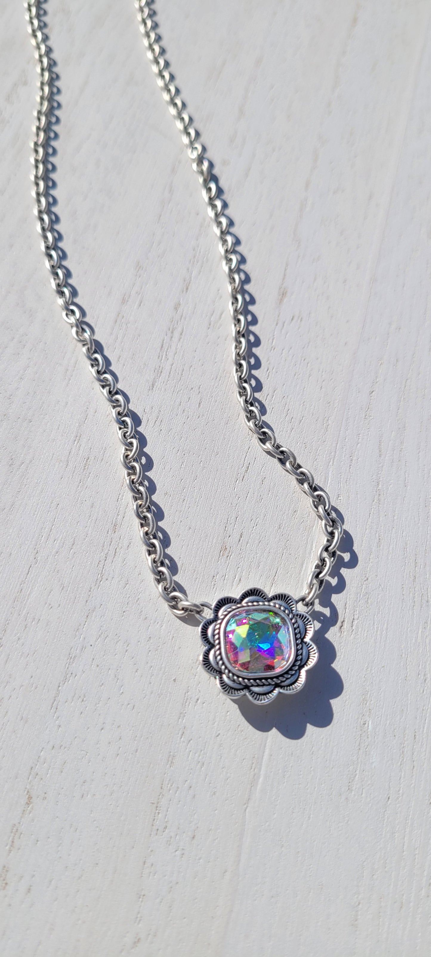 Pink Panache necklace Color: Small silver oval link chain necklace with 12mm silver/AB ruffle edge cushion cut pendant Limited supply!
