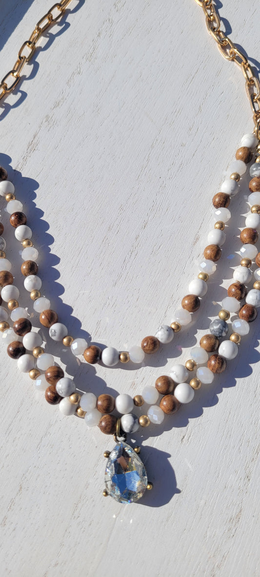 Pink Panache Necklace Triple strand white stone, wood bead and gold chain necklace with clear teardrop pendant Limited supply!