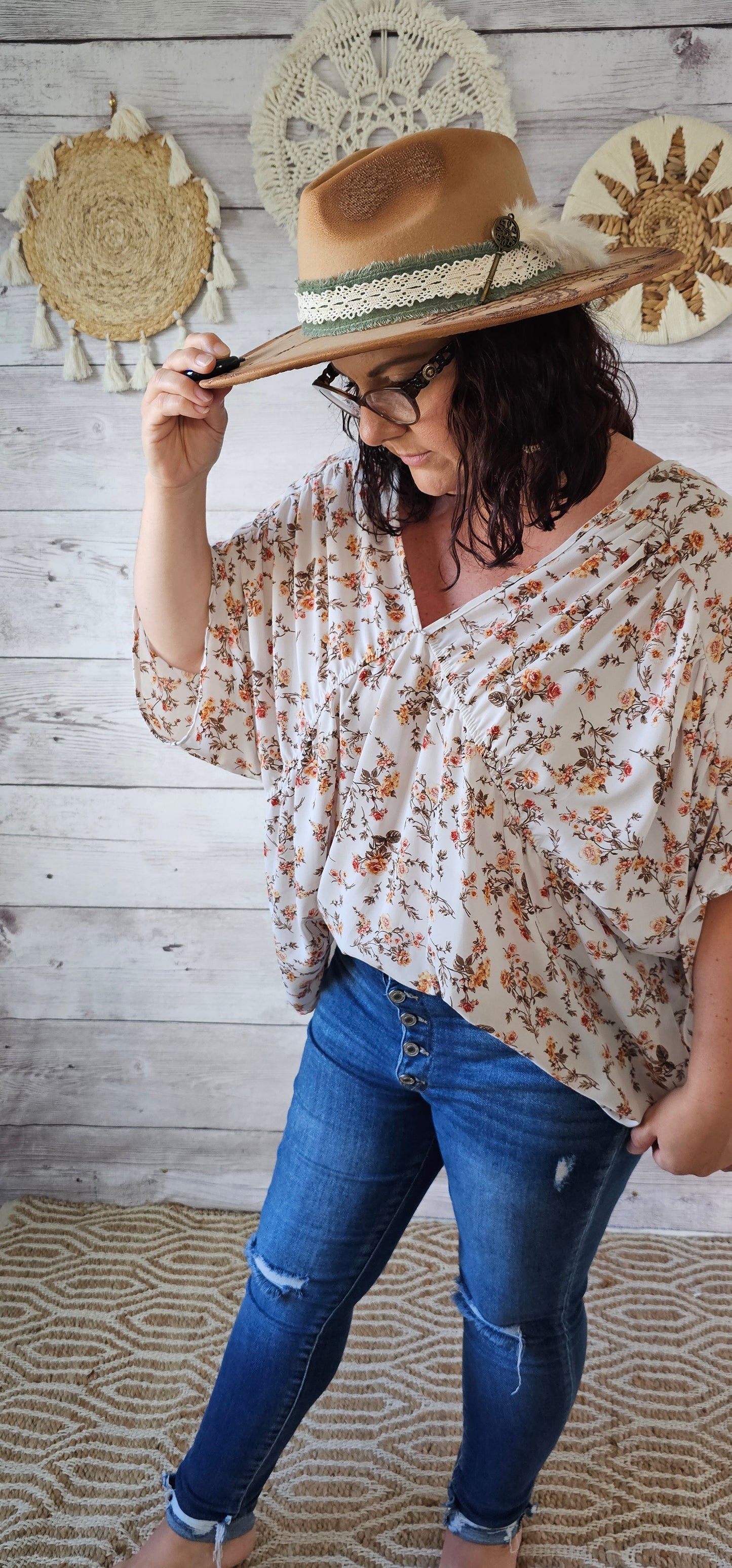 “Rosy Future” is a ivory loose fitting, flowy top. It features a rosy floral print, v-neck and v-back, pleated sleeves. This top is sheer but not see through. It is great for vacation, an evening out or casual event. Sizes small through large.
