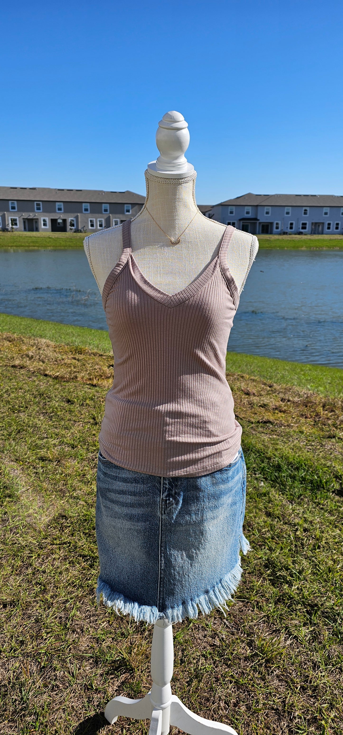 This “Basic Babe Tank Top: Ash Mocha” features a ribbed fabric, sleeveless tank top with v-neck and back. This is a great basic staple piece! Sizes small through x-large.