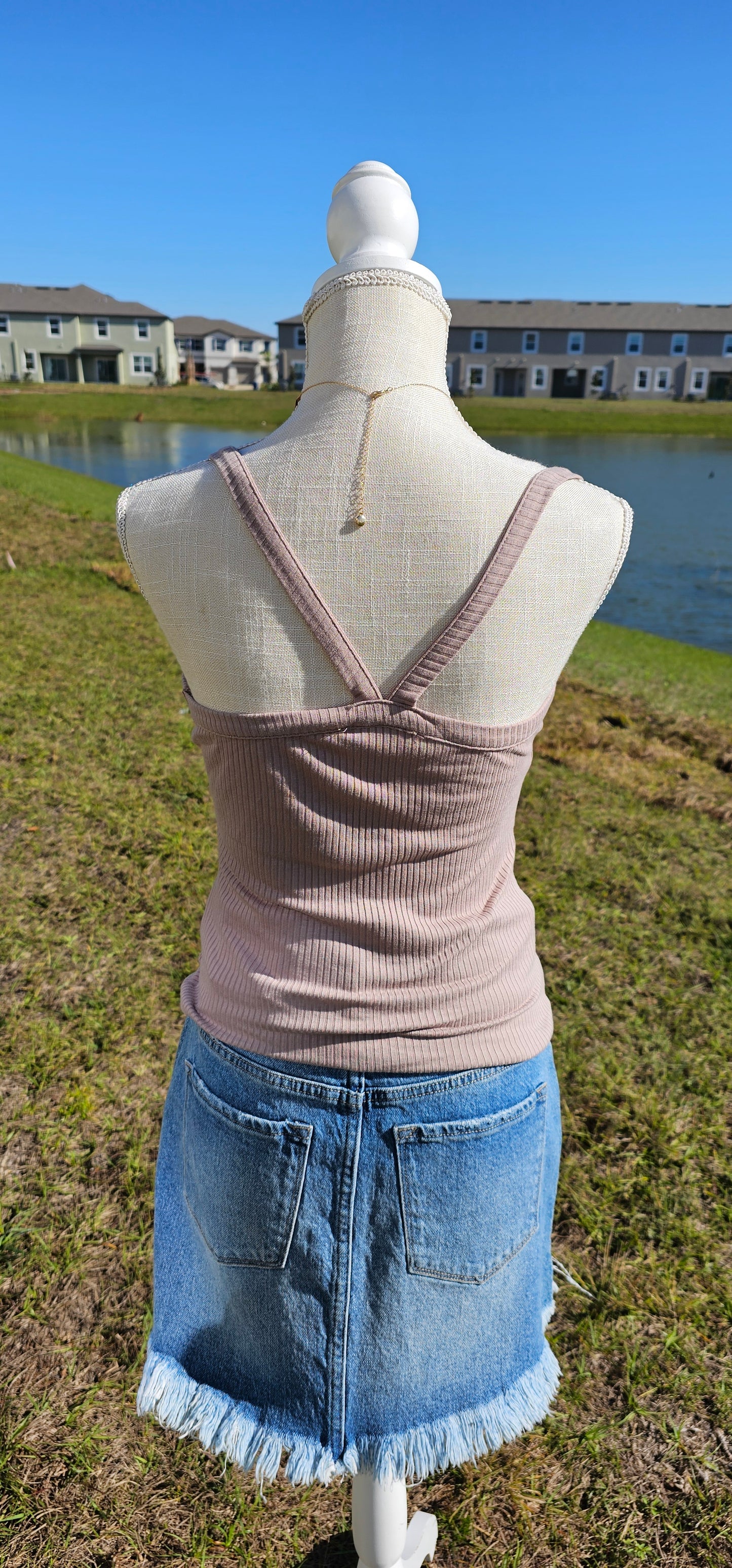 This “Basic Babe Tank Top: Ash Mocha” features a ribbed fabric, sleeveless tank top with v-neck and back. This is a great basic staple piece! Sizes small through x-large.