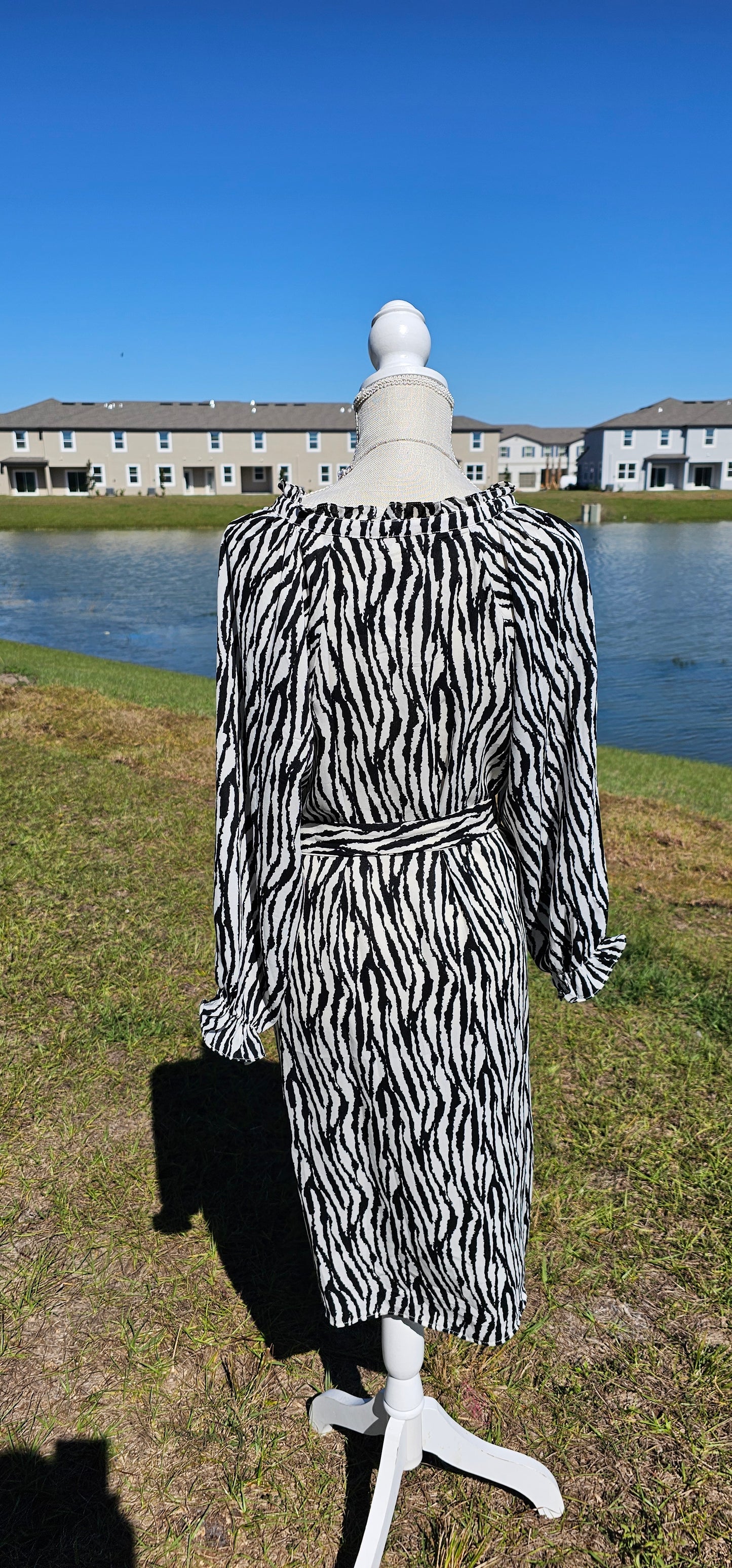 Get in touch with your bold and wild side! This dress is classy, sassy, and badassy! Colors are black and off white. This zebra print dress features a ruffle collar, ¾ balloon sleeves with ruffles, waist tie, v-neck, and sits below the knees. Good for a night out with the girls, office or business attire. Don’t be afraid to get creative! Sizes small through large.