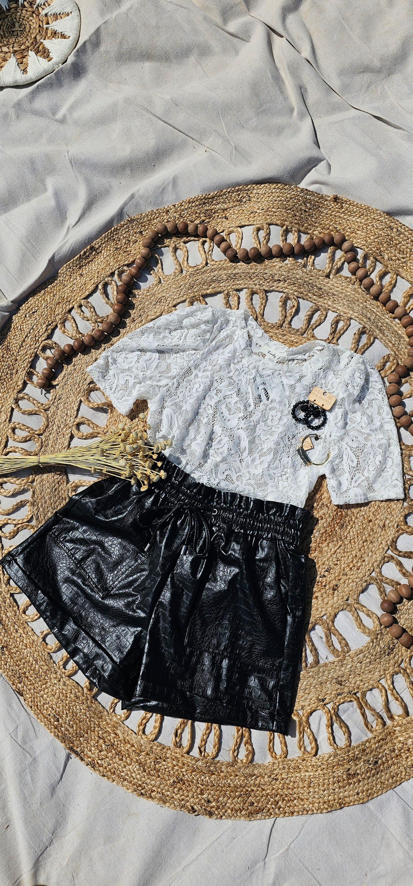 Crocodile Rock is a crocodile pattern, vegan leather, paper bag shorts, with a drawstring elastic waistline and pockets. These shorts are dressy enough to wear to the office, a weekend trip with the girls, or just because. I dare you to give them a try! Sizes small through x-large.