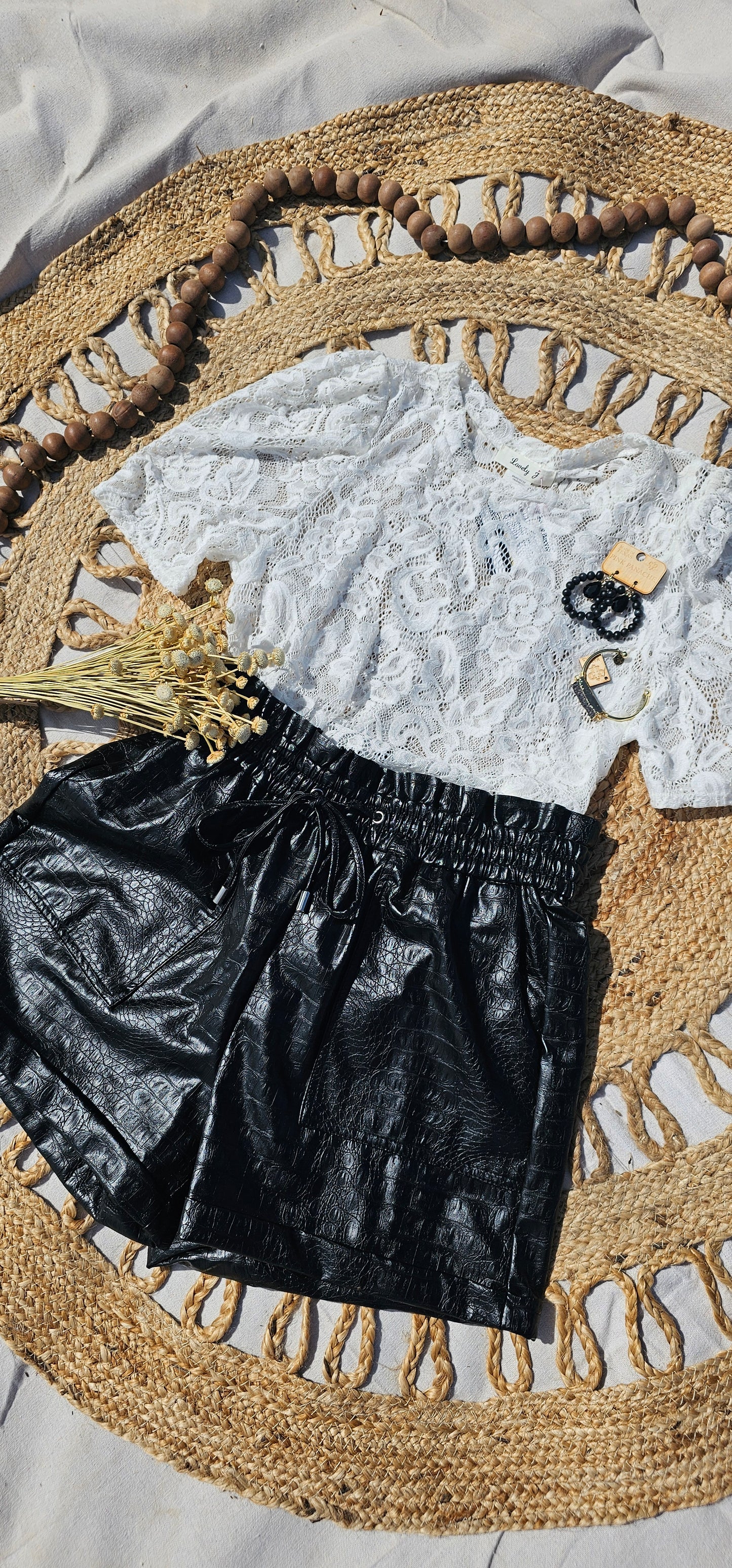 Crocodile Rock is a crocodile pattern, vegan leather, paper bag shorts, with a drawstring elastic waistline and pockets. These shorts are dressy enough to wear to the office, a weekend trip with the girls, or just because. I dare you to give them a try! Sizes small through x-large.