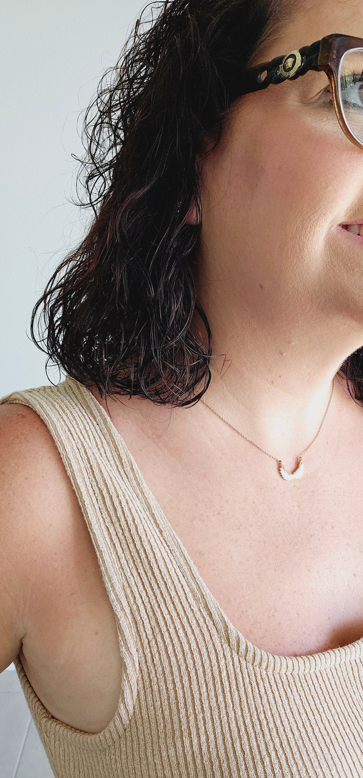 This tank top features a unique square neckline and a classic ribbed design in a washed tan color. Perfect for layering or wearing on its own, this tank is a versatile addition to your wardrobe. Sizes small through large.