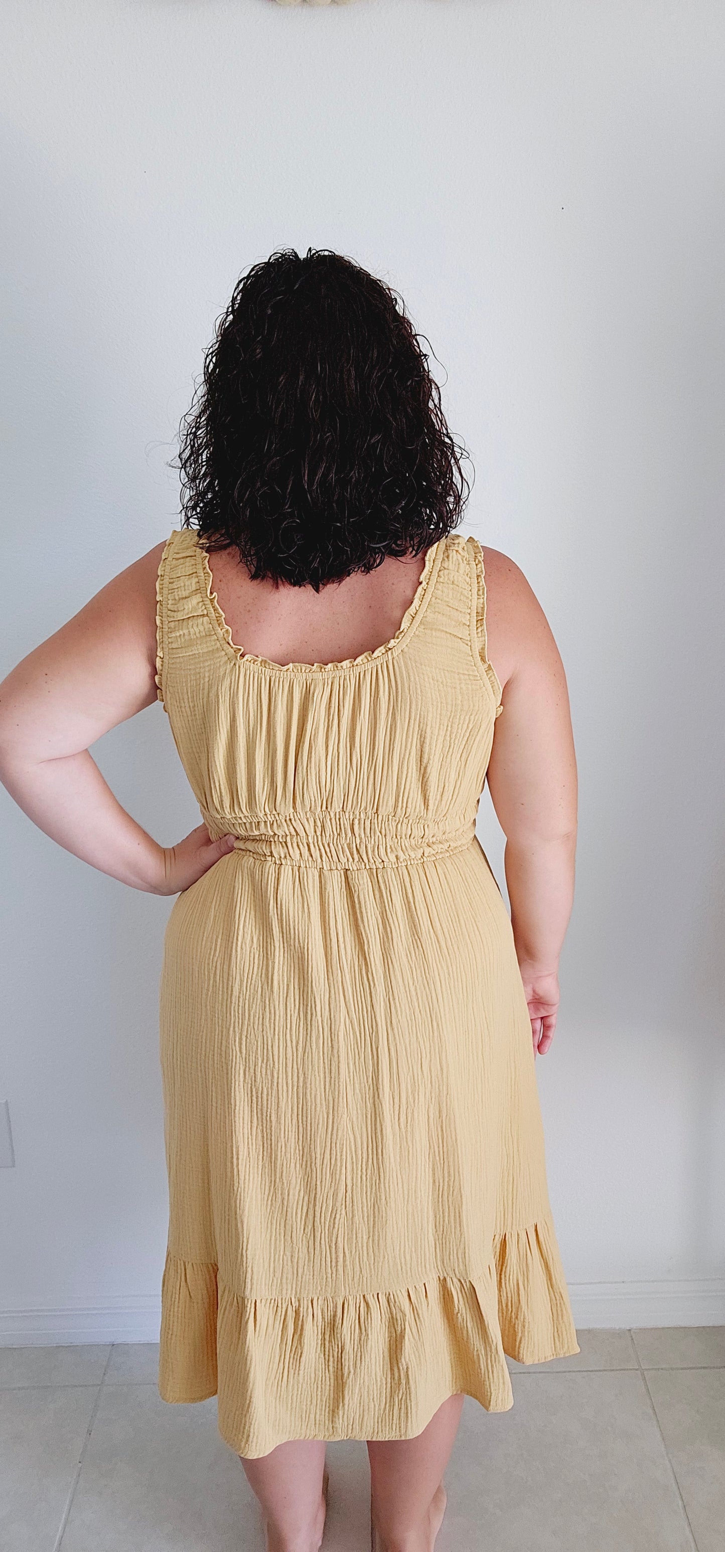 Get ready for a summer sensation with the Delilah tiered gauze midi dress! Made with lightweight cotton gauze, this dress features shirring, ruffles, and elastic for a perfect fit. Plus, pockets for convenience. It's the perfect dress for a fun and playful look. Sizes small through large.