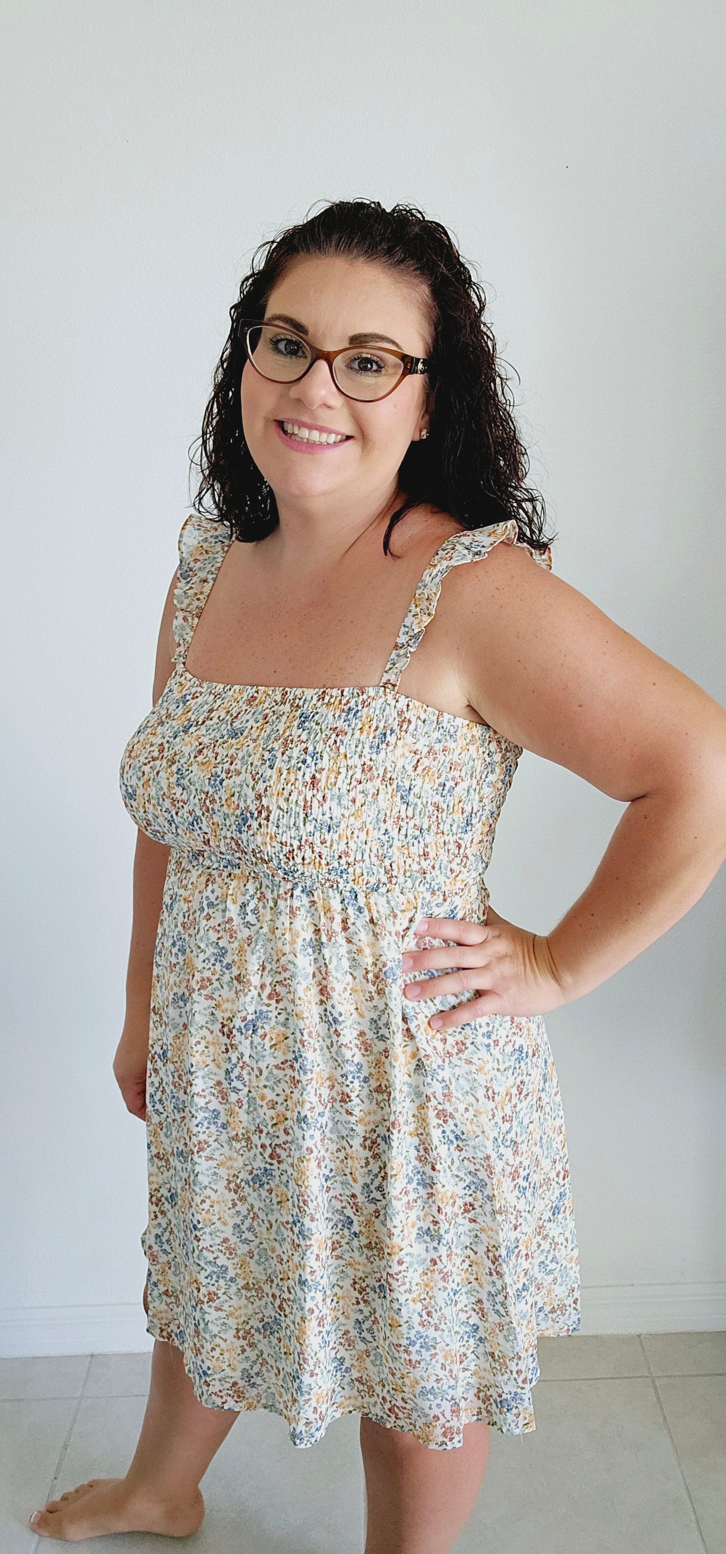 Stay cool and stylish this summer with this adorable dress! Featuring ruffle straps, smocking on the chest, and a trendy ditsy print, this dress is perfect for any summer occasion. Don't sacrifice comfort for style - this mini dress has got you covered. Sizes small through large.