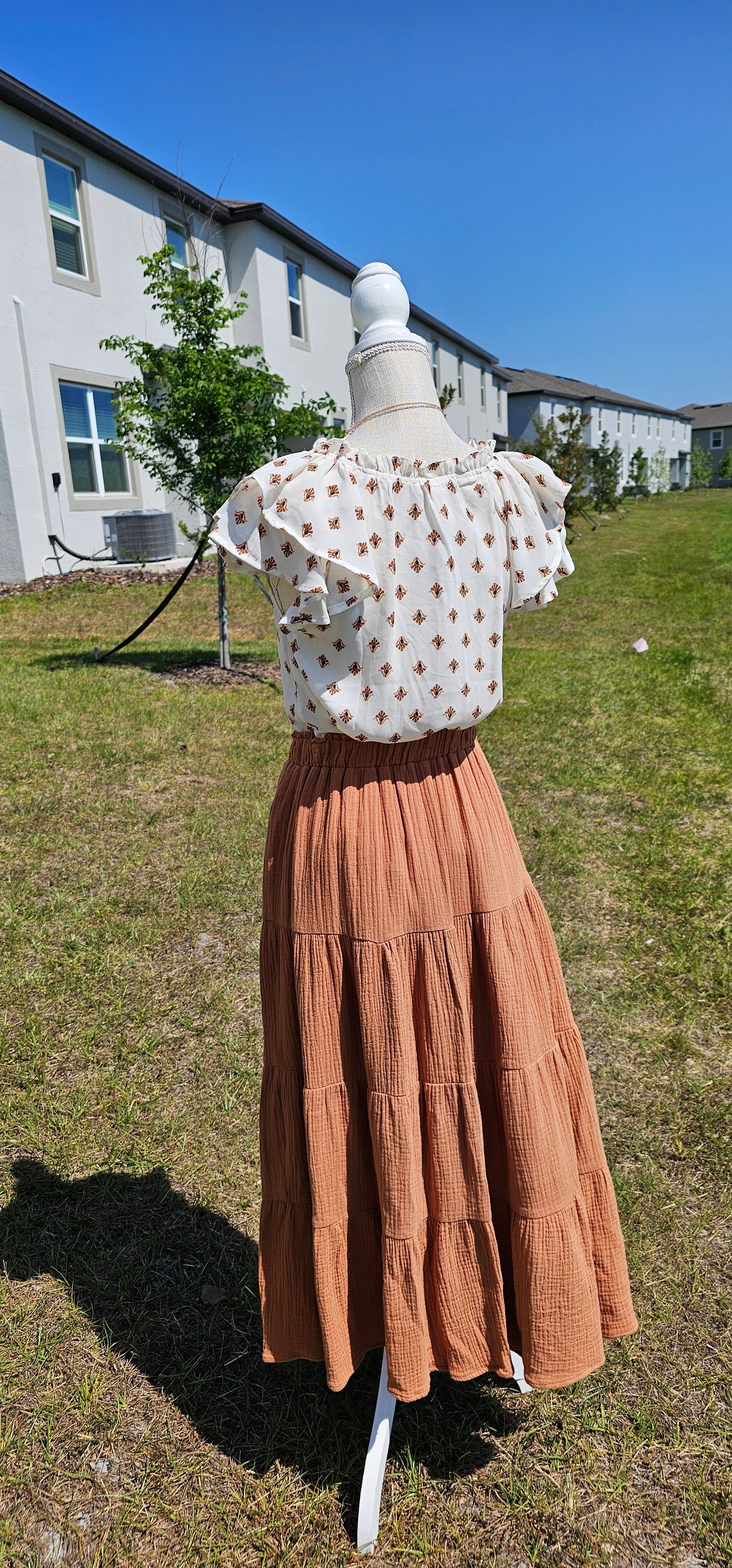 Be an angel in this gorgeous tiered maxi skirt! This airy, layered design features an elasticized waist, which gives you the freedom to move and groove how you like. And if that wasn't enough, it's topped off with a folded ruffle waist trim for a look that's nothing short of heavenly! Take flight and show off your style! Sizes small through large.