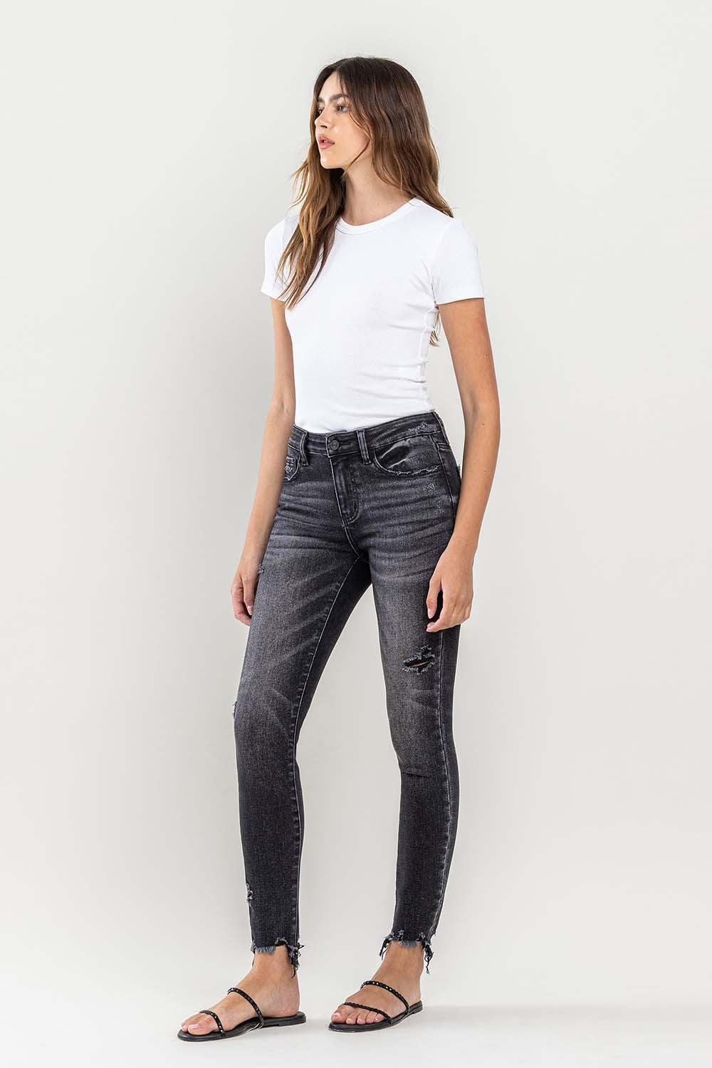 These raw hem cropped skinny jeans are a must-have for any fashion-forward individual. The raw hem adds a touch of edge to the classic skinny jeans silhouette. The cropped length is perfect for showcasing your favorite footwear. 24-32