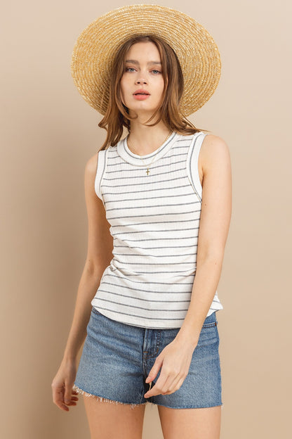 Stay cool and stylish this summer with our Striped Round Neck Tank. Made from soft and breathable fabric, this tank features a classic round neck design and trendy striped pattern. Perfect for pairing with your favorite jeans or shorts for a casual and chic look. Available in a variety of colors to suit your style preferences.  S-L