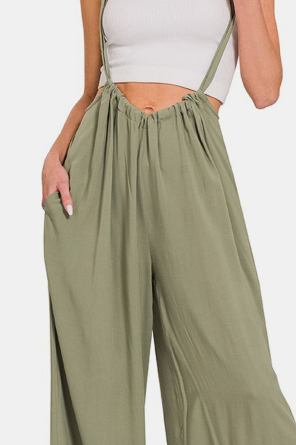 Pocketed Wide Strap Wide Leg Overalls are a trendy and functional fashion choice. Featuring wide straps for added comfort and style, these overalls are designed with a wide-leg silhouette for a chic and relaxed look. The addition of pockets adds practicality to this versatile piece, allowing you to carry small essentials while on the go. Whether paired with a casual tee or dressed up with a blouse, these overalls are a fashion-forward option for any casual outing. S-L