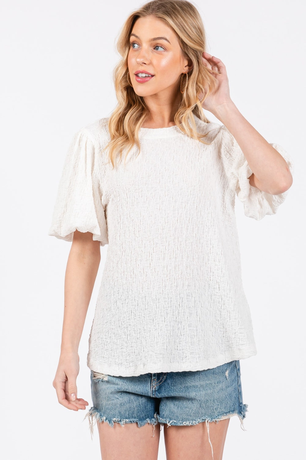 The Textured Puff Sleeve Top is a trendy and feminine top that adds a touch of drama to any outfit. The textured fabric creates visual interest and dimension, making it a standout piece in your wardrobe. The puff sleeves add a playful and romantic vibe to the top, perfect for both casual and dressy occasions. S-L