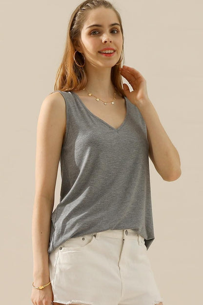The V-Neck Curved Hem Tank is a stylish and versatile piece. With its flattering neckline and curved hem, it adds a touch of femininity to any outfit. The tank's relaxed fit provides comfort without sacrificing style. S - 3X